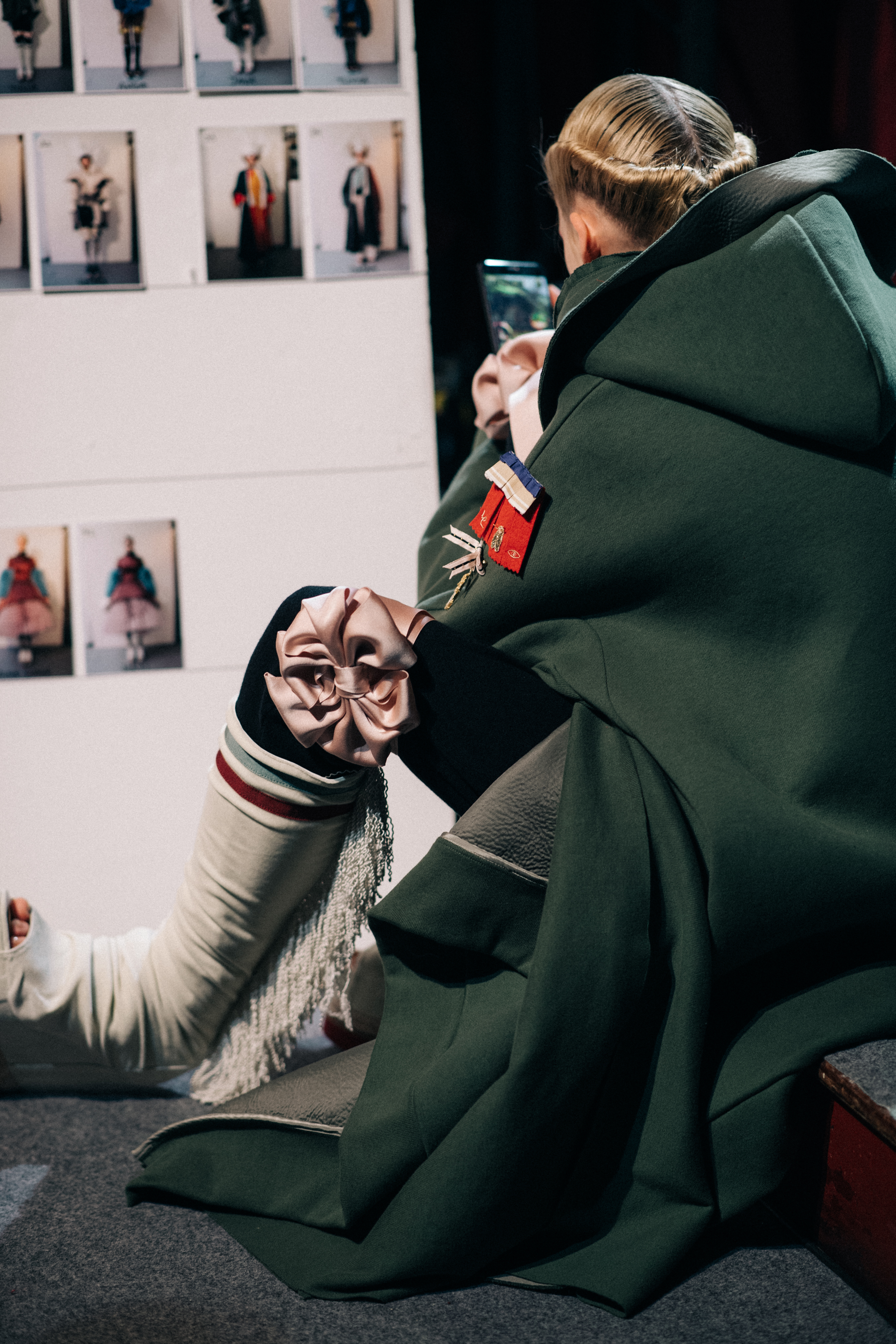 Model wearing long green coat