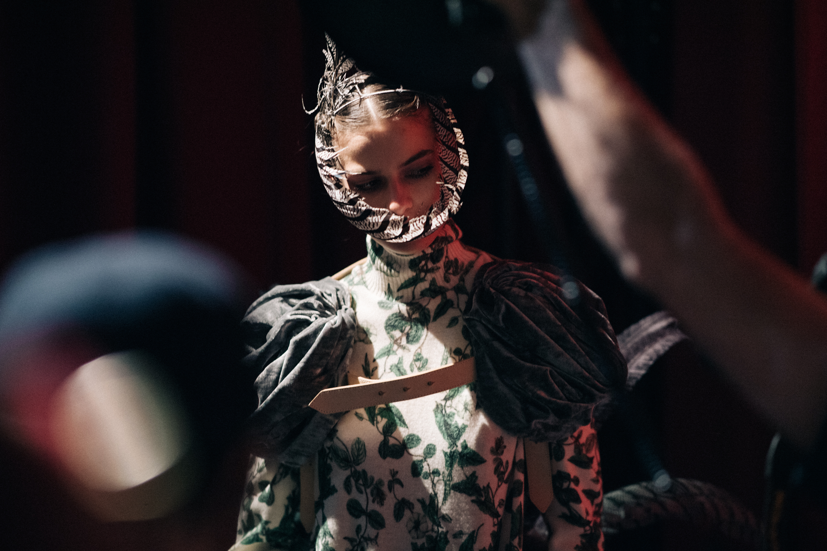 Dasha Denisenko wearing feather masks