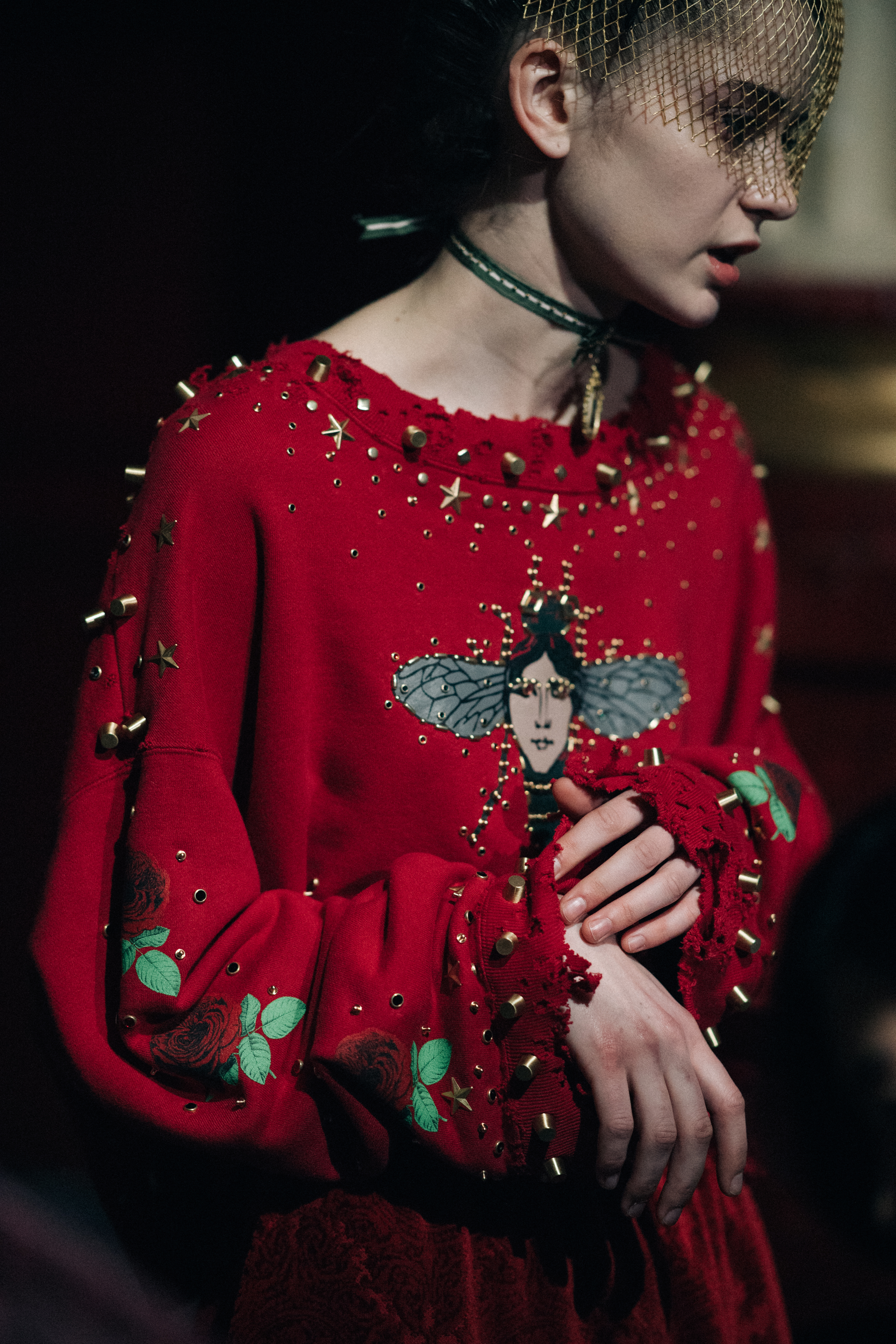 Model wearing red embroidered longsleeve