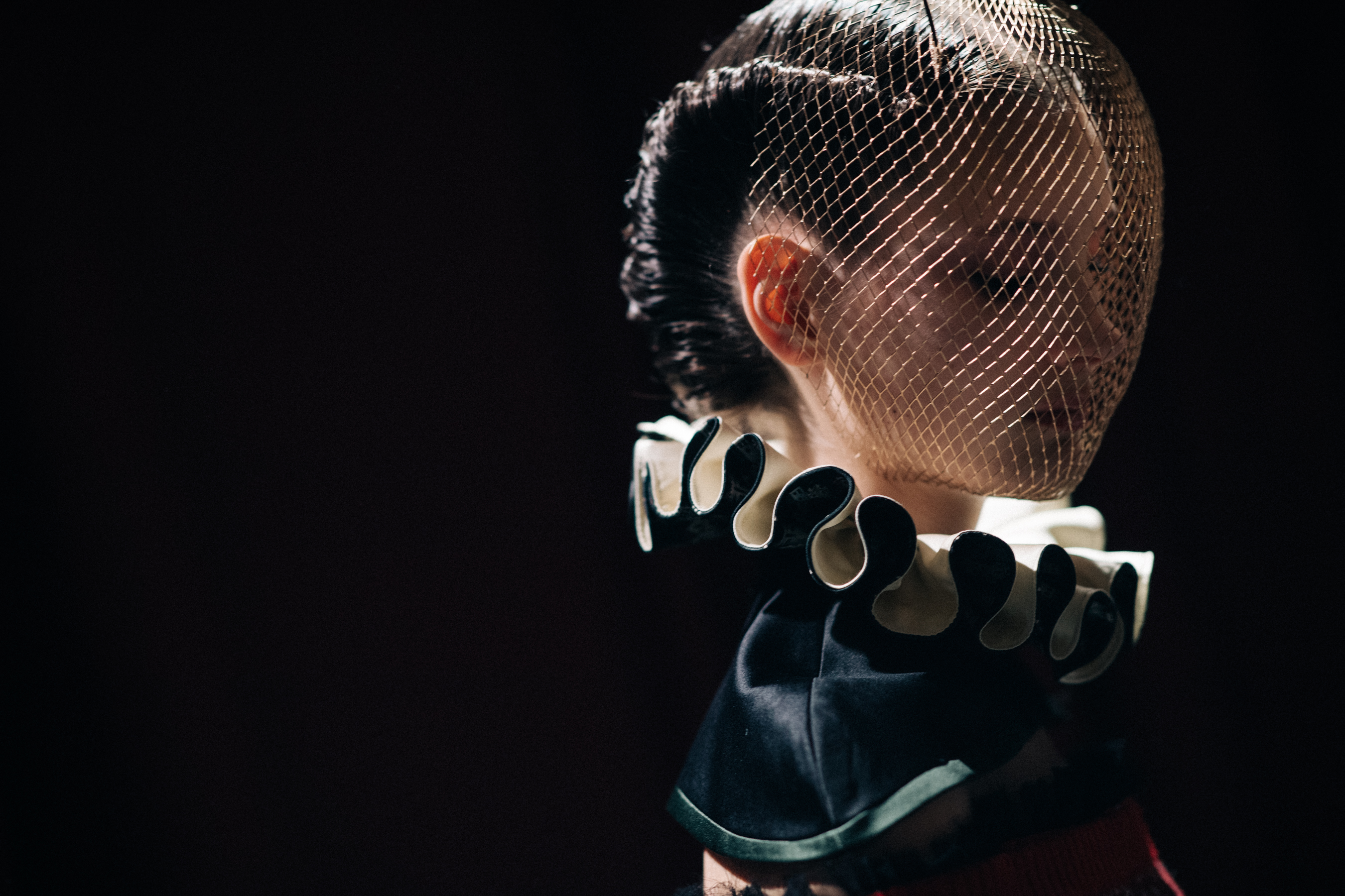Model Regan Garrett wearing fencing mask