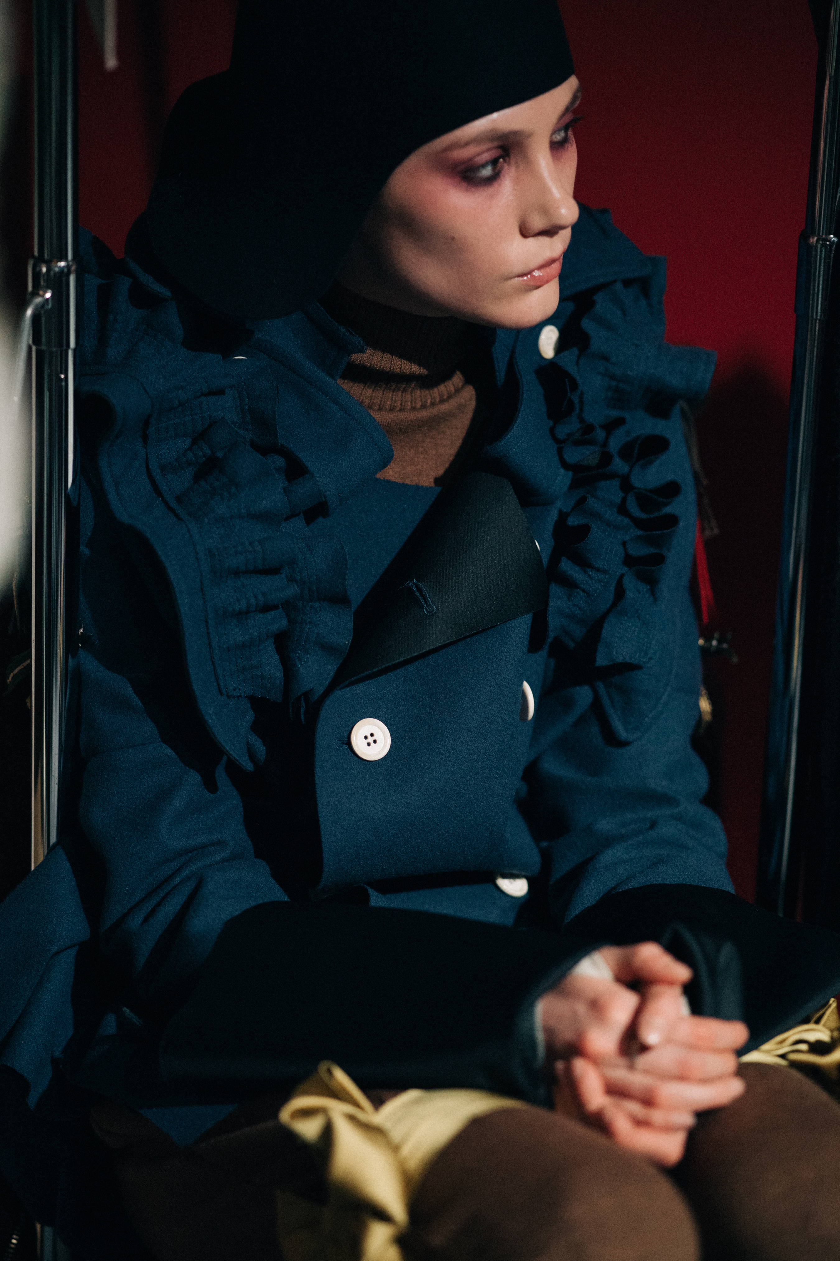 Model wearing blue jacket
