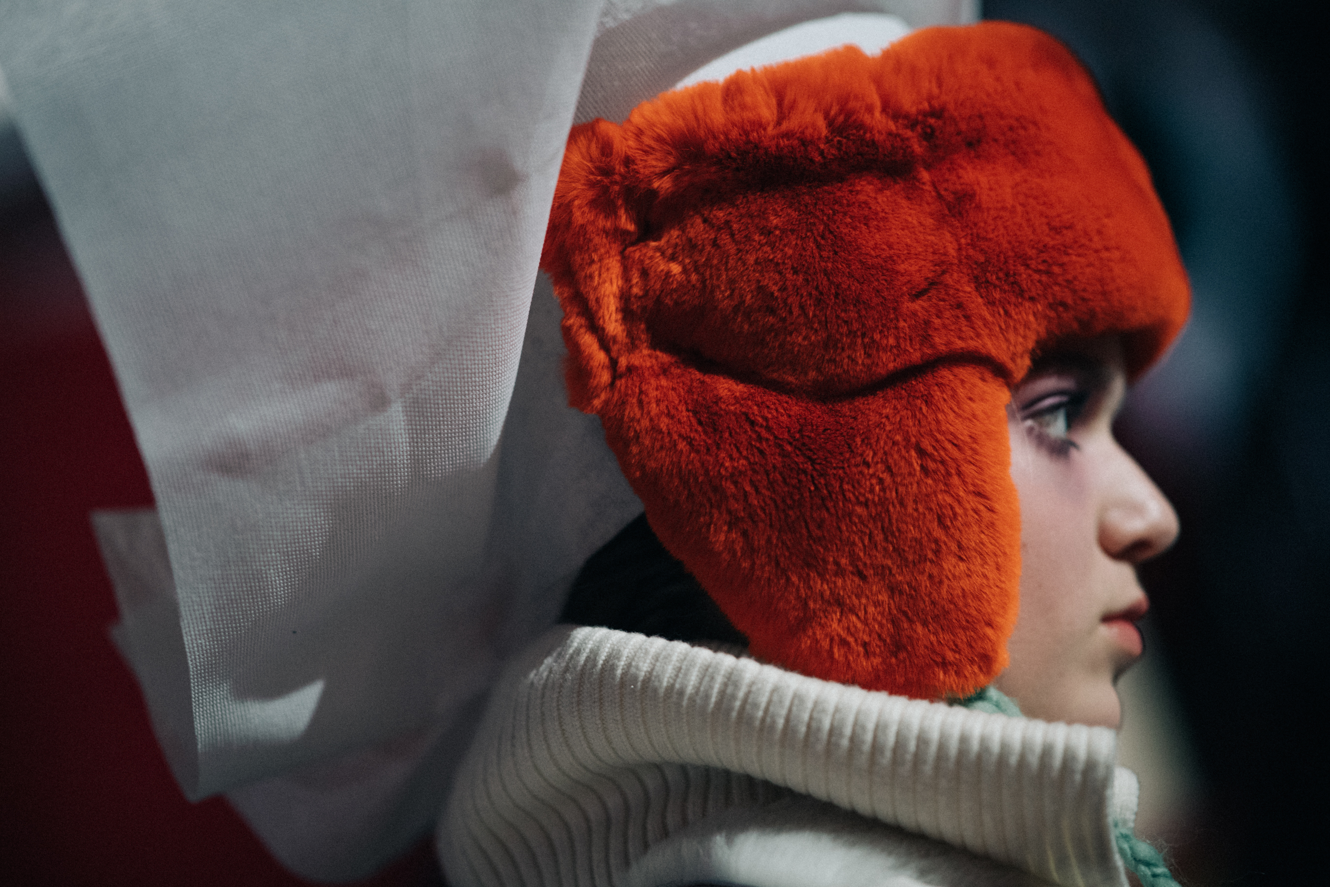 Tasya Vorobeva wearing orange hat