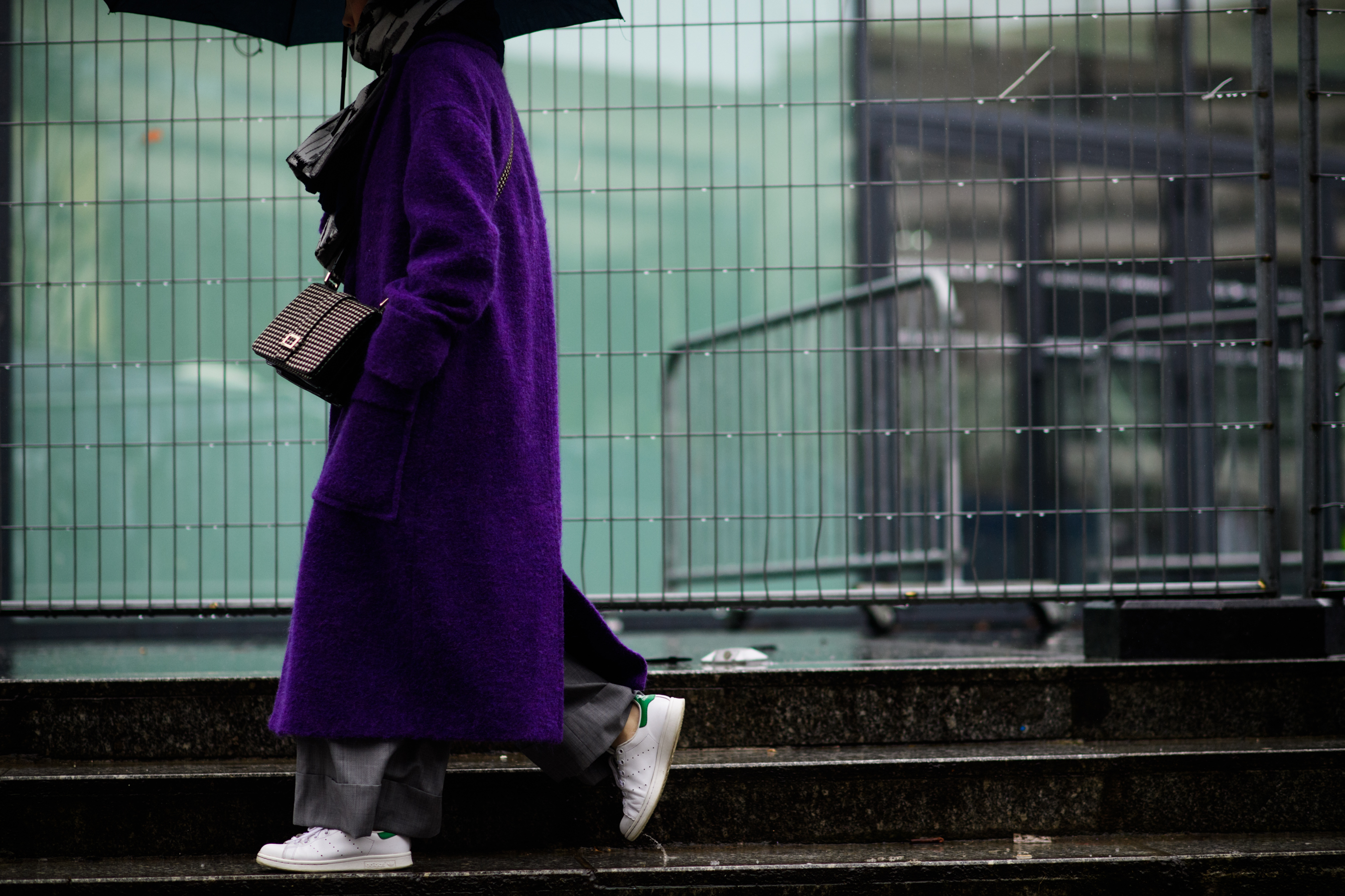 Woman wearing long purple coat