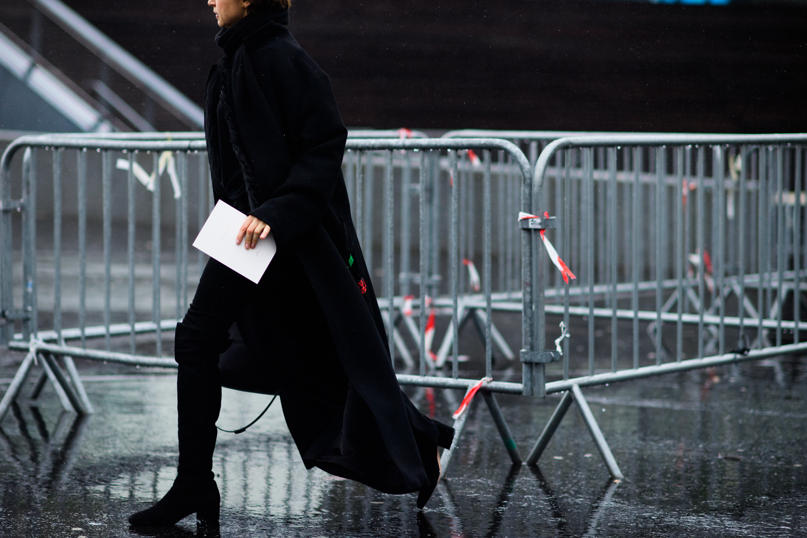 Woman wearing long black coat