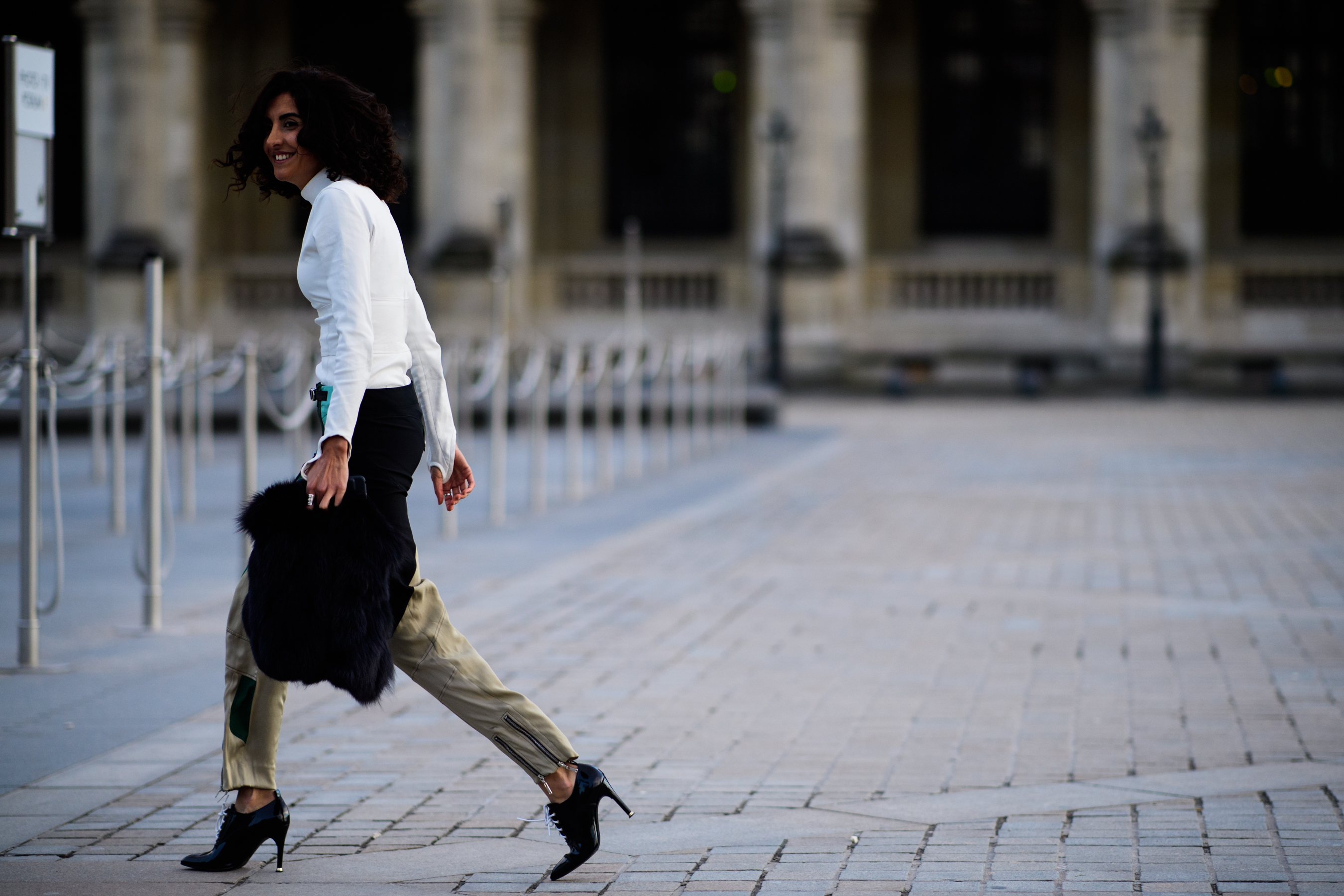 Woman with furry hand bag
