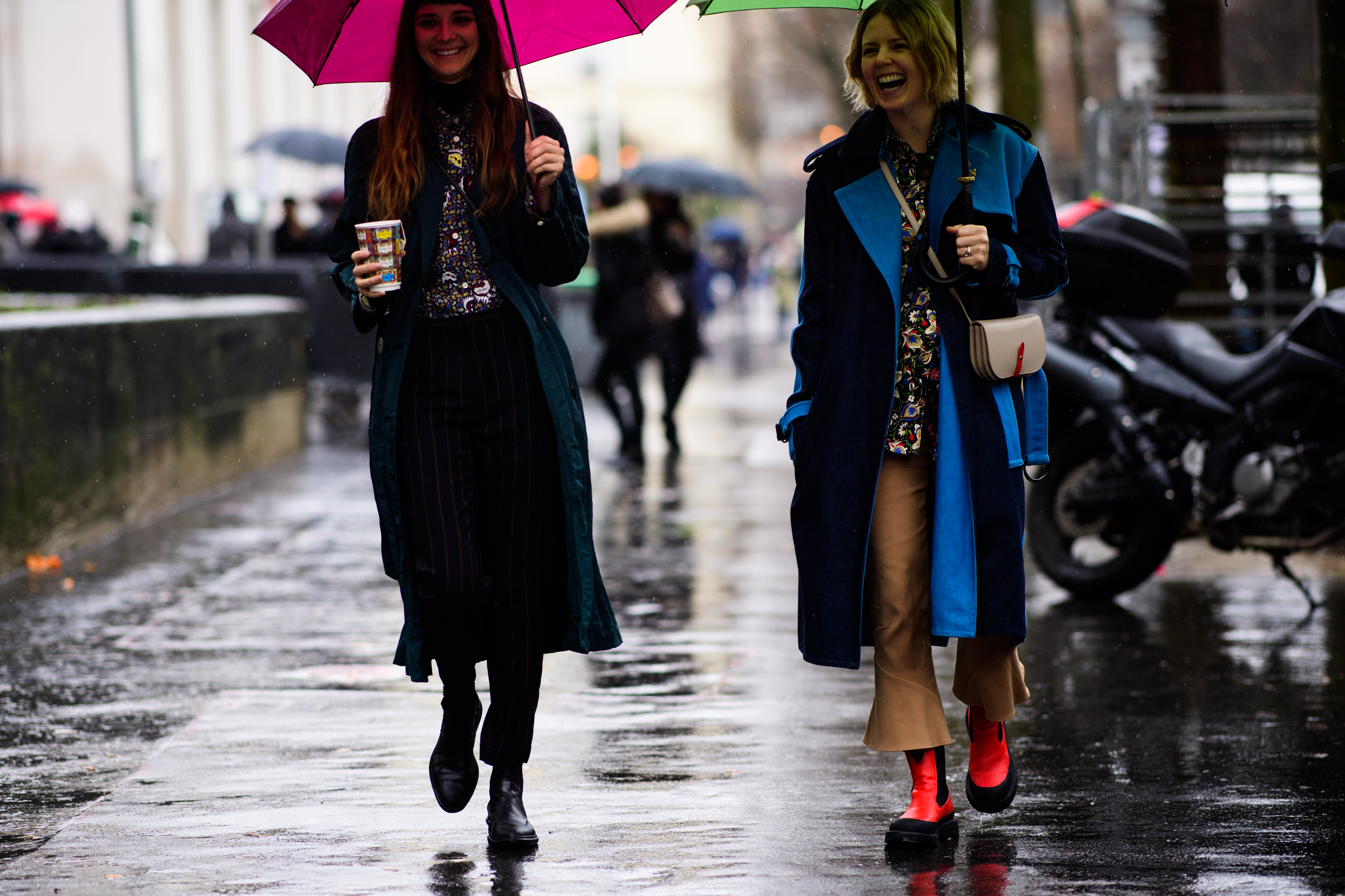 Two women with umbrellas after Mugler