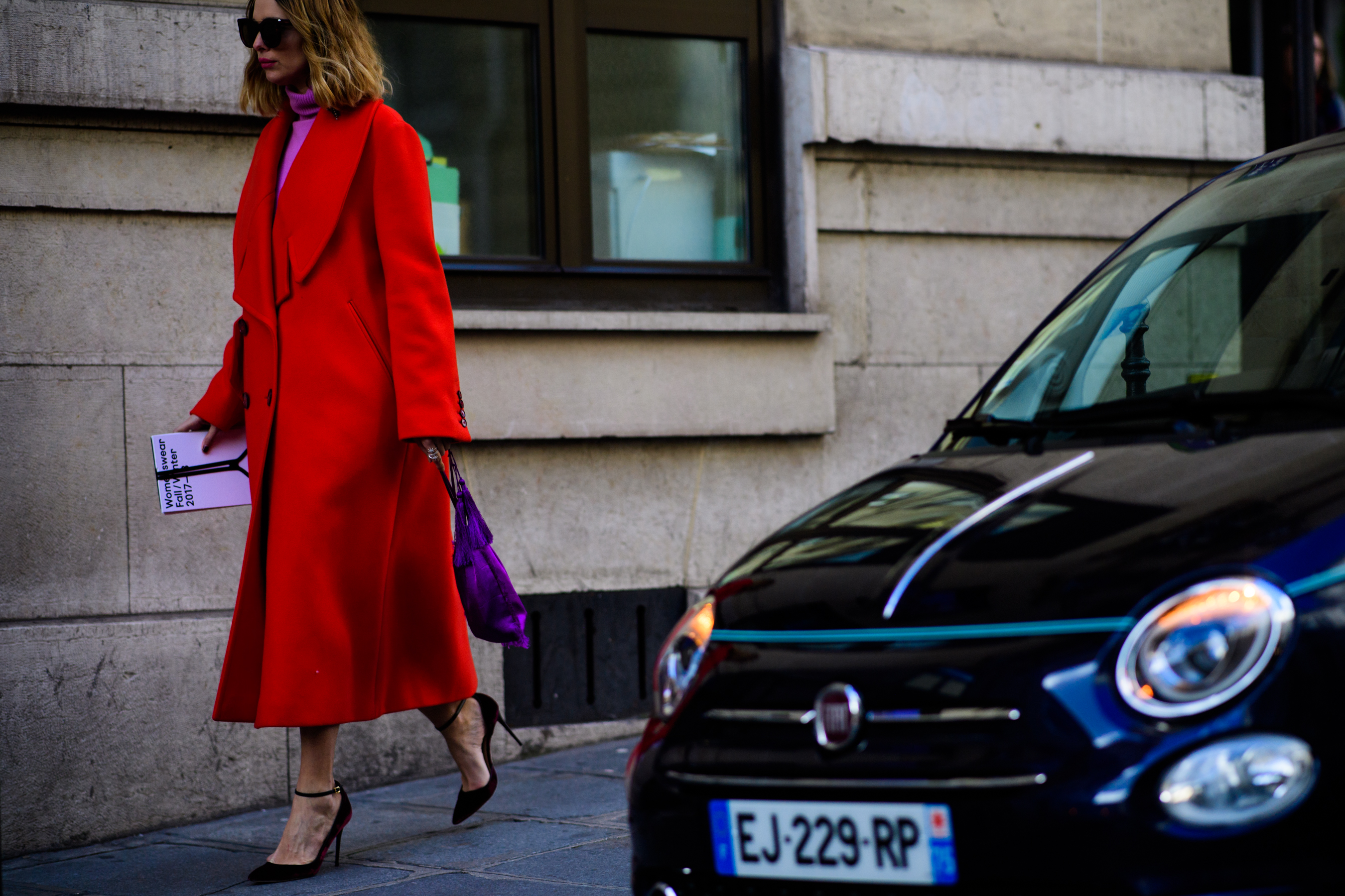 Argentinian blogger wearing long red coat