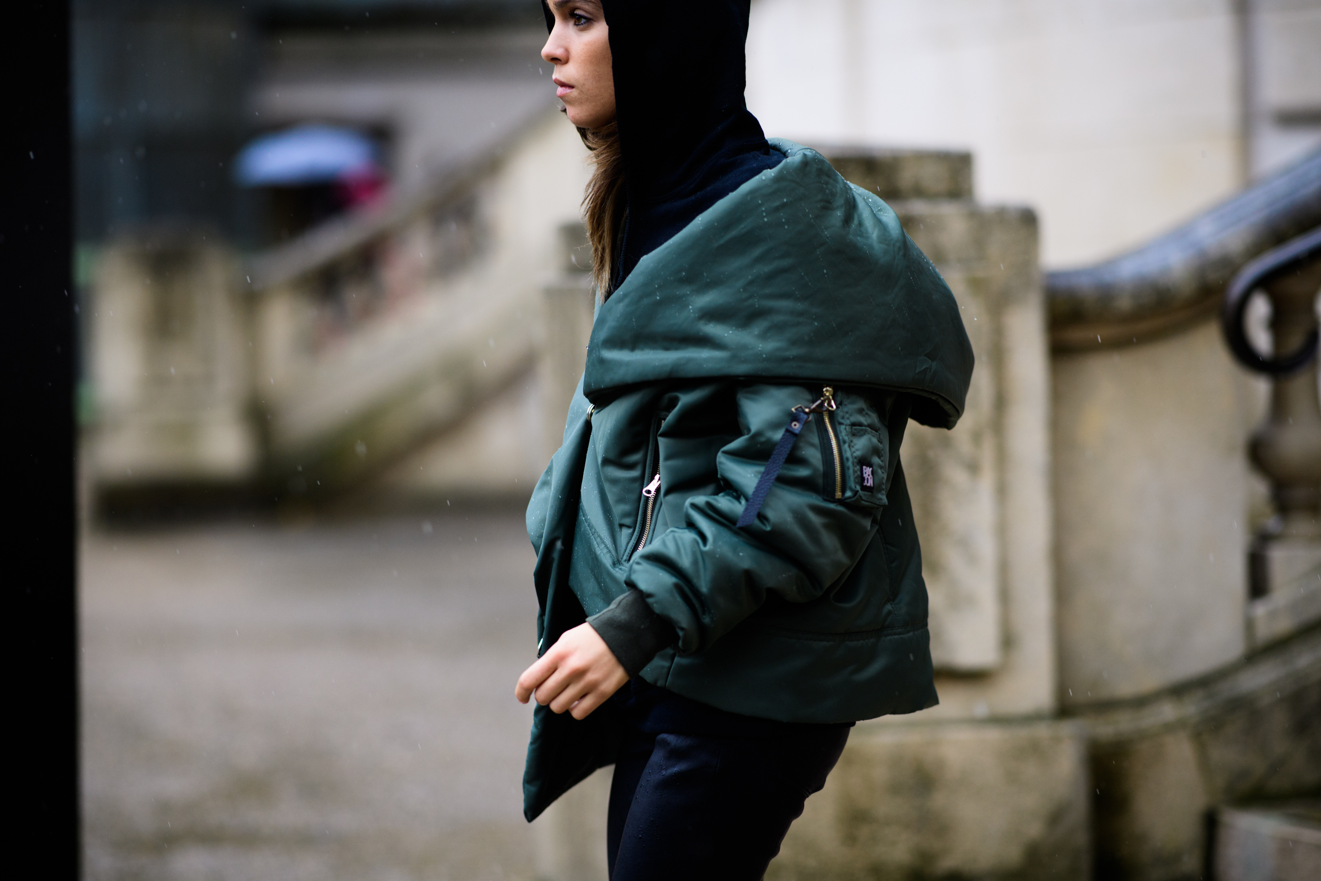 Italian woman wearing green bomber