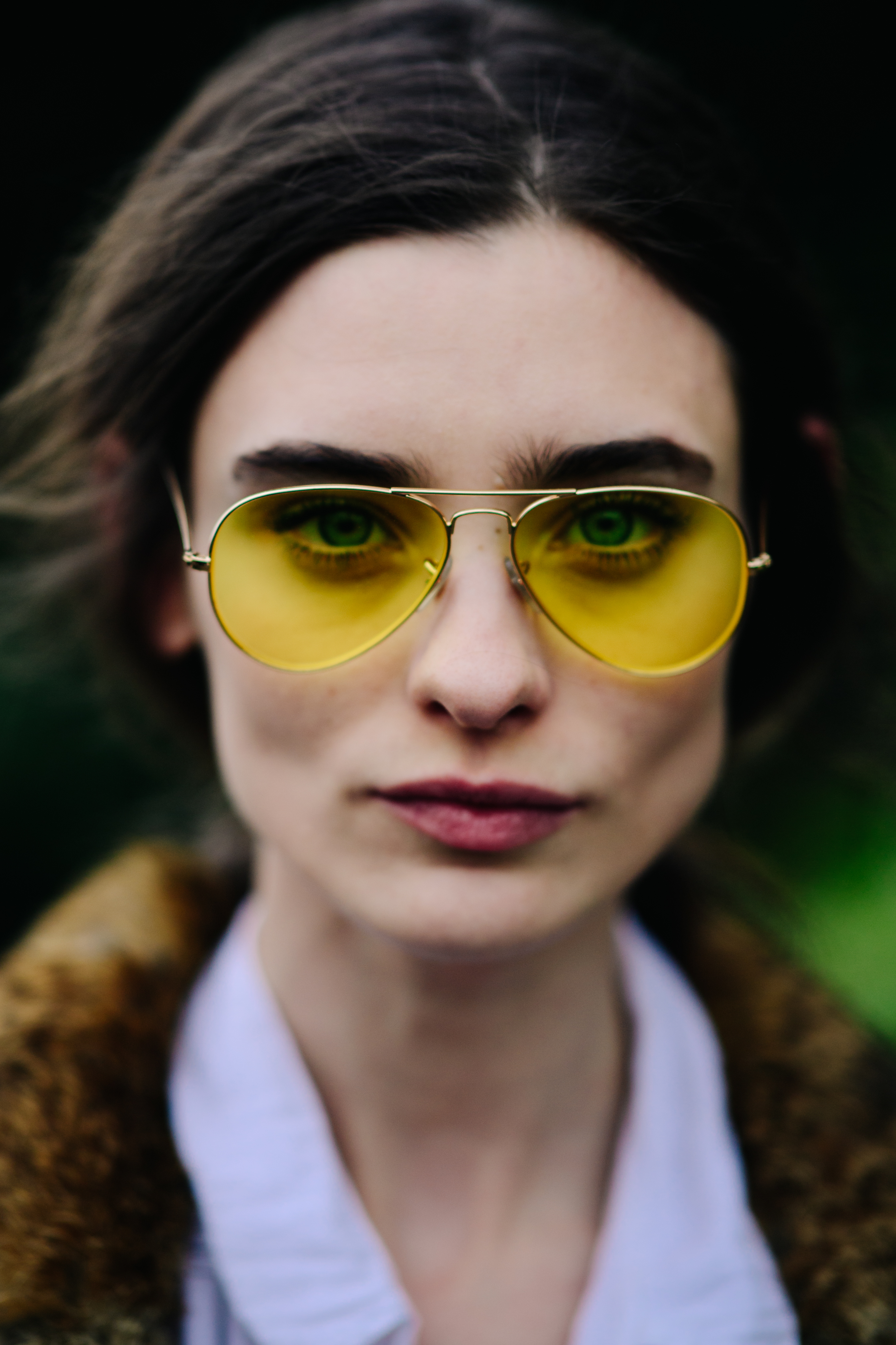 Model wearing yellow sun glasses