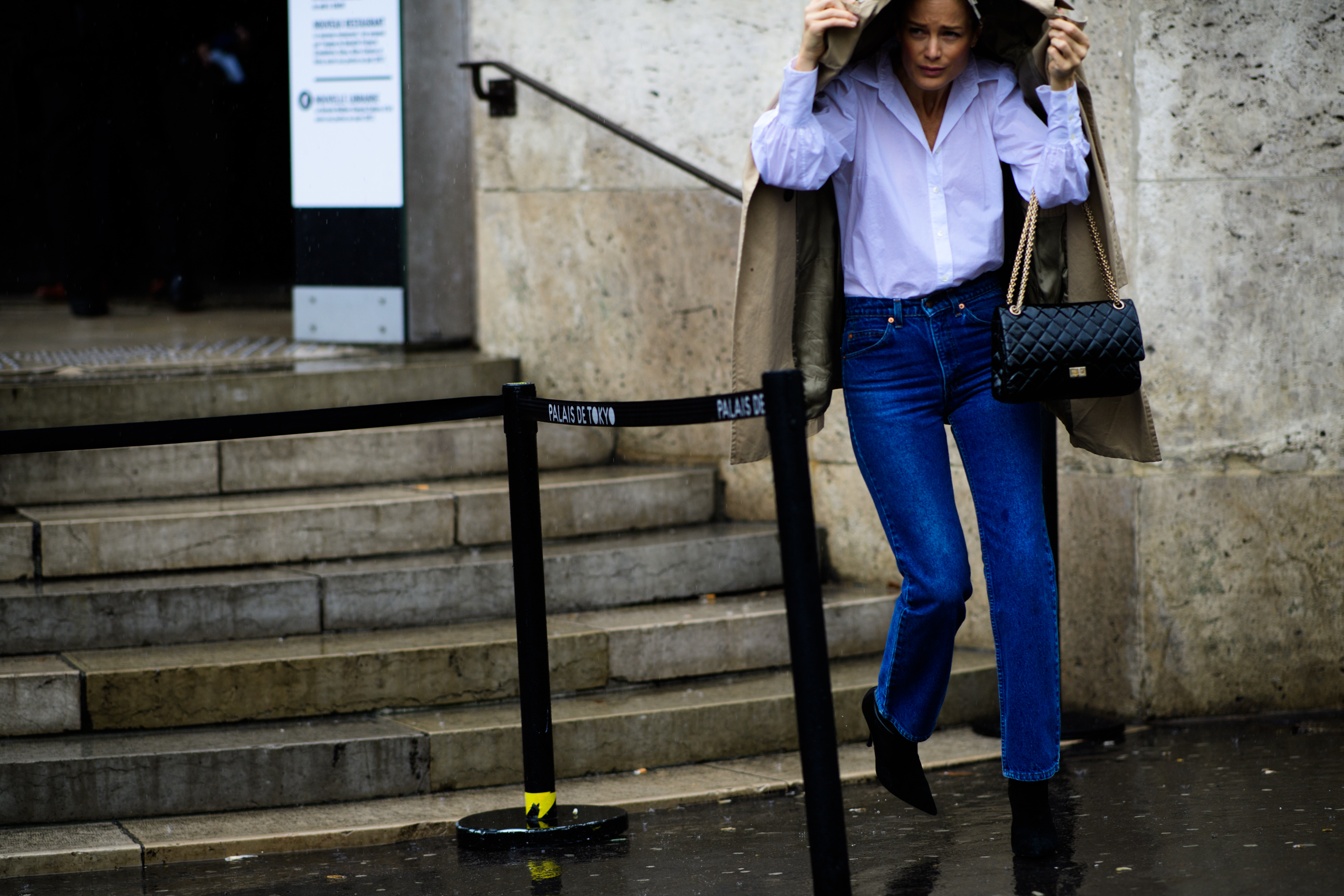 Woman wearing white shirt and denim