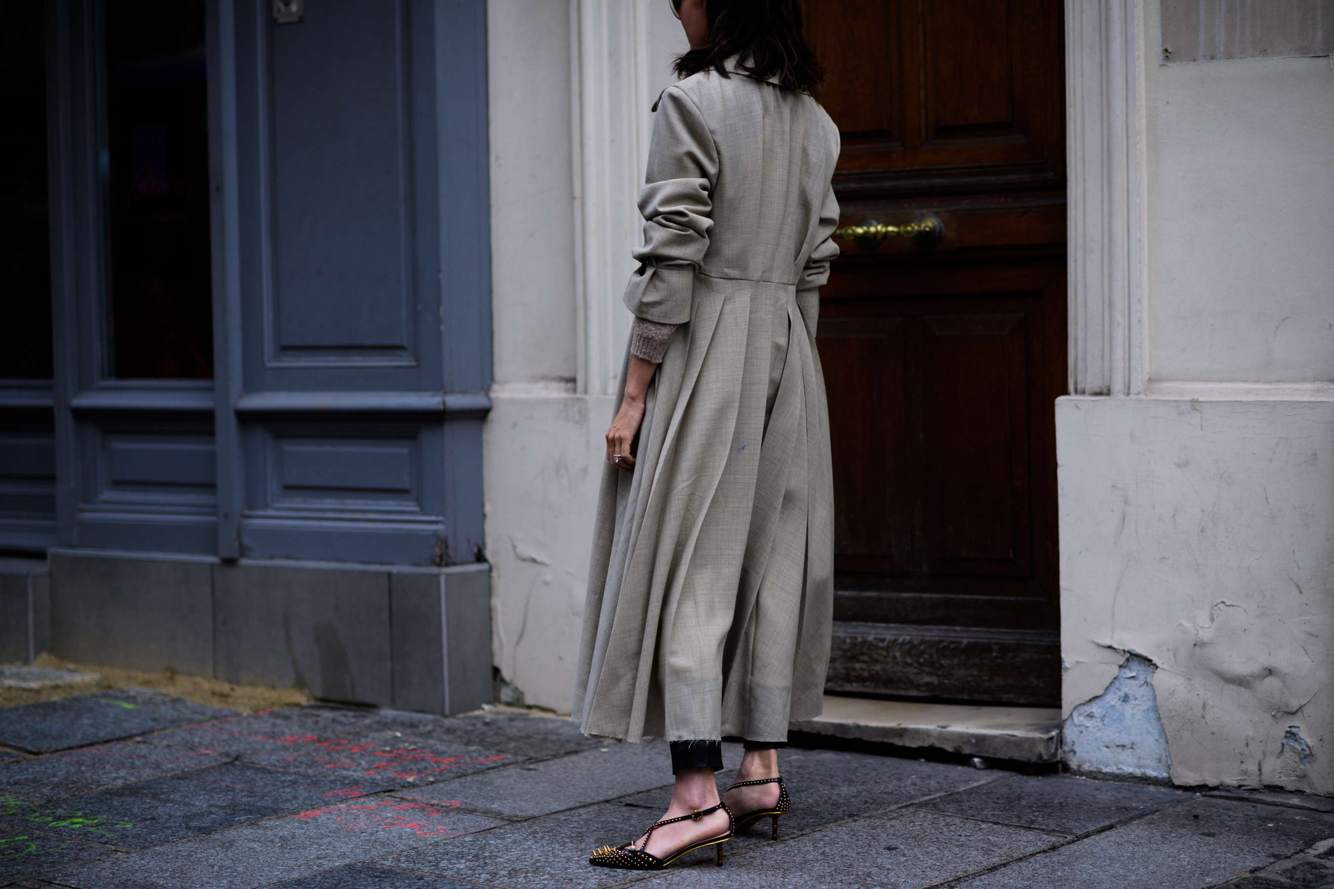 Woman wearing long beige coat