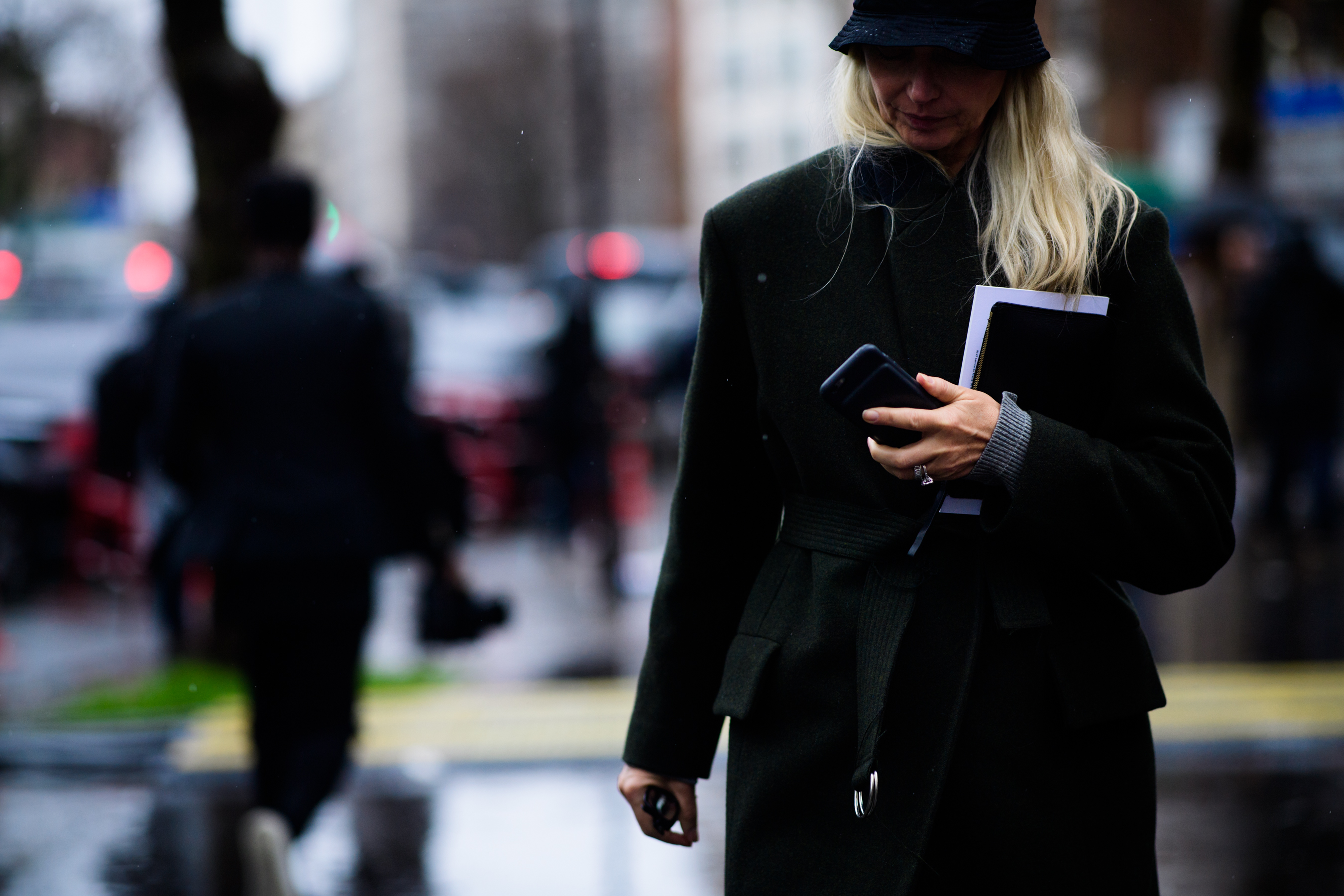 German stylist wearing green coat