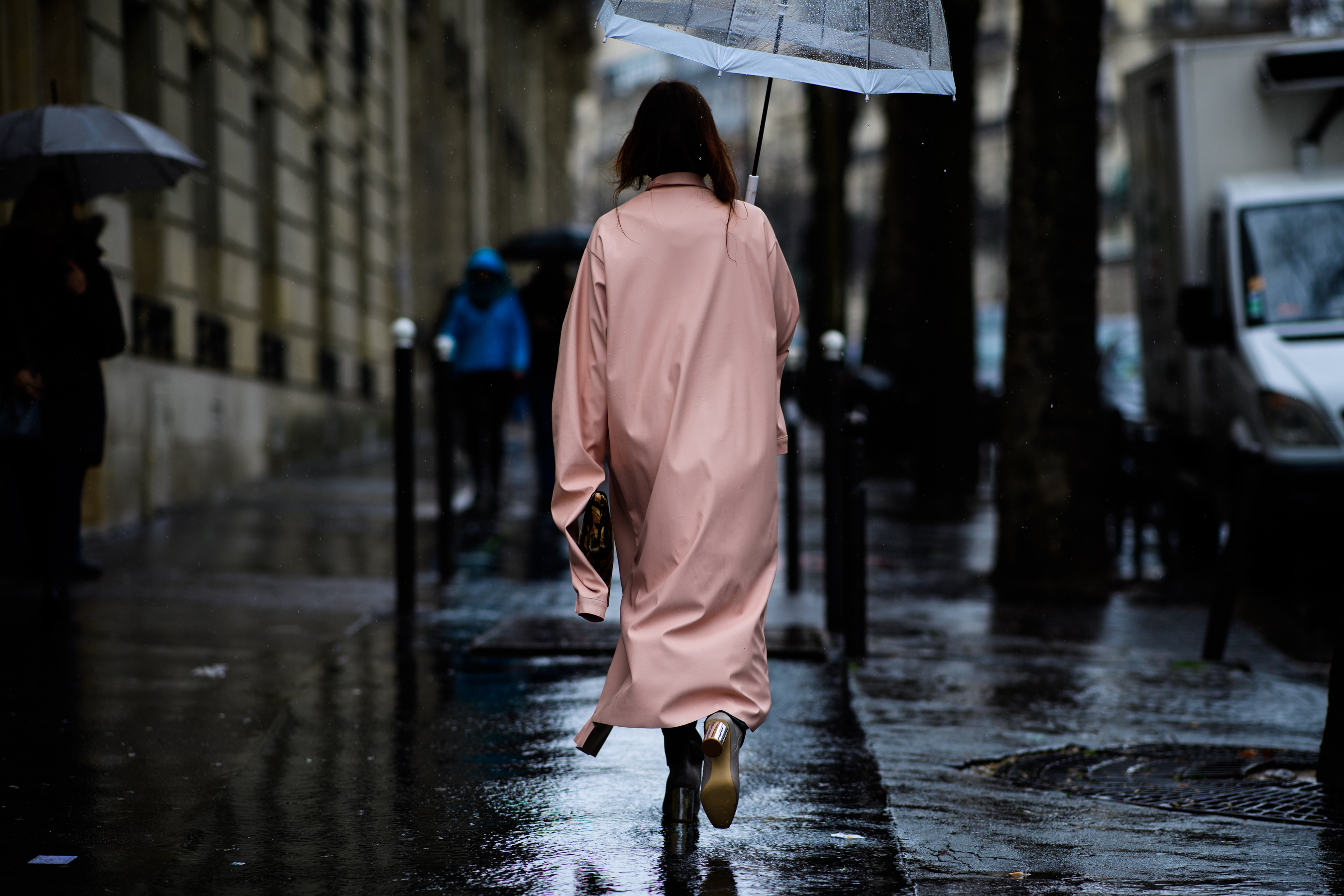 Italian blogger wearing pink rain coat