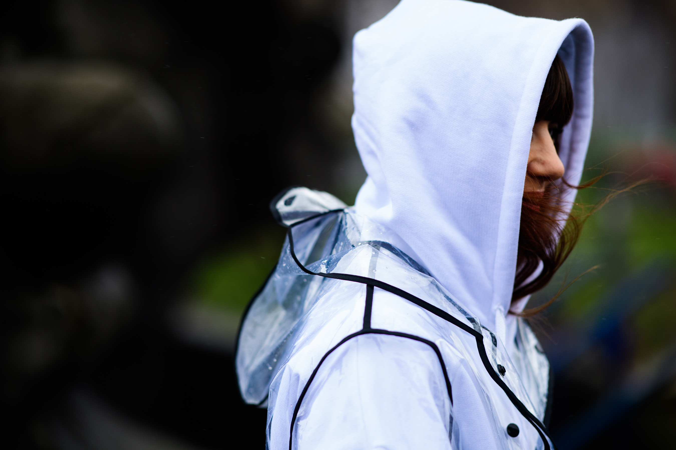 Italian woman wearing transparent rain coat