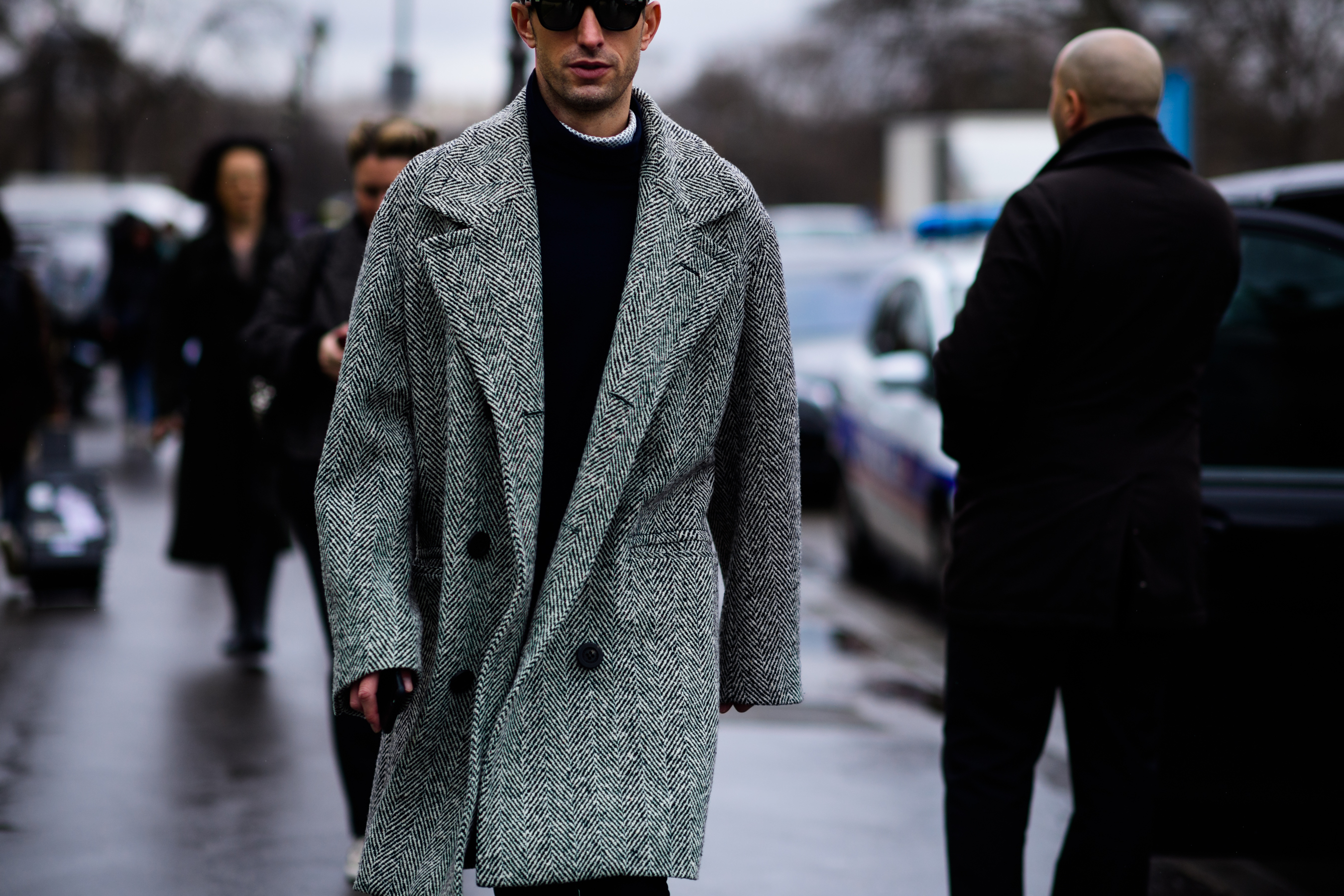 Man wearing black and white coat