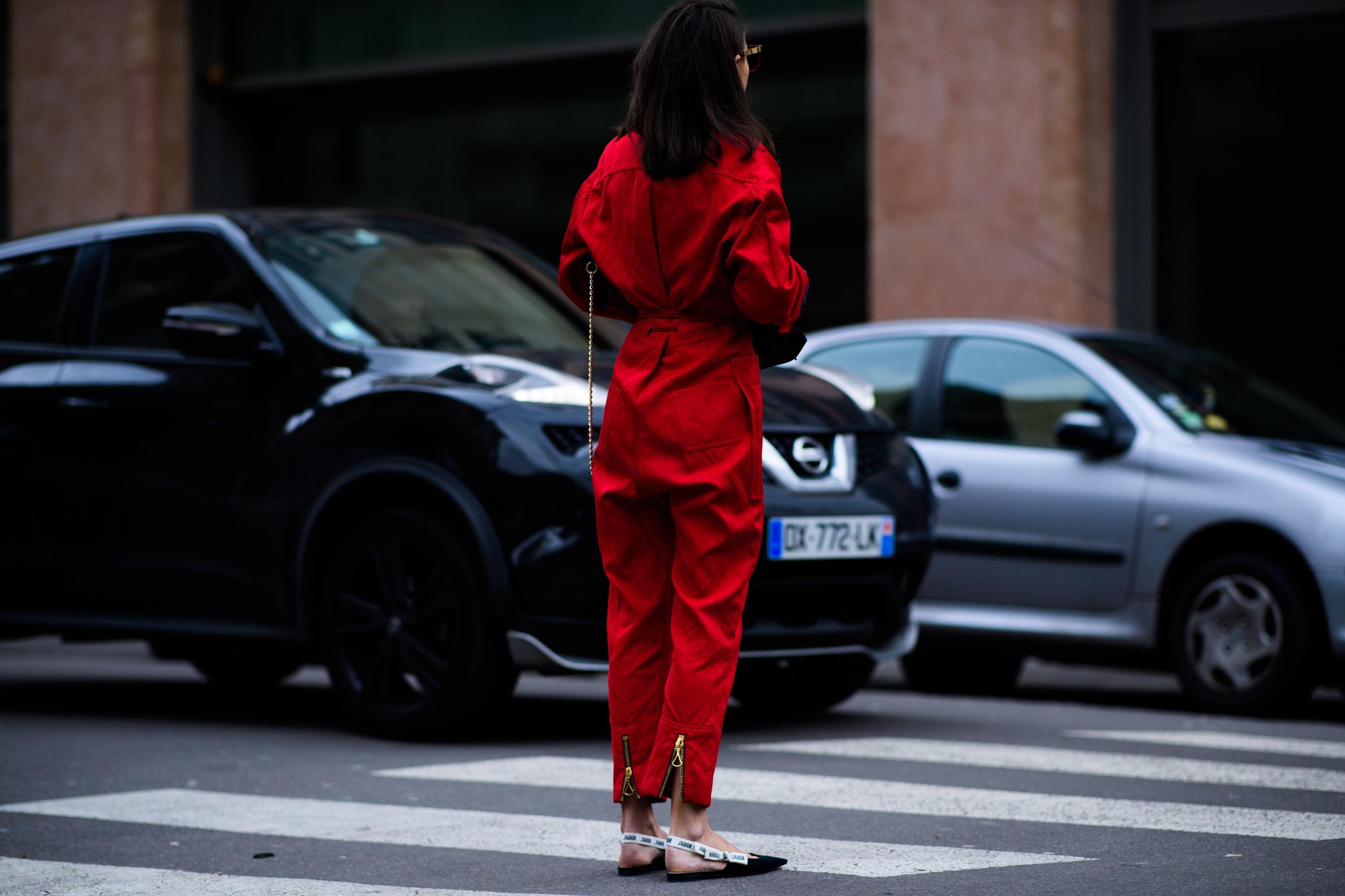 Italian woman wearing red jumpsuit