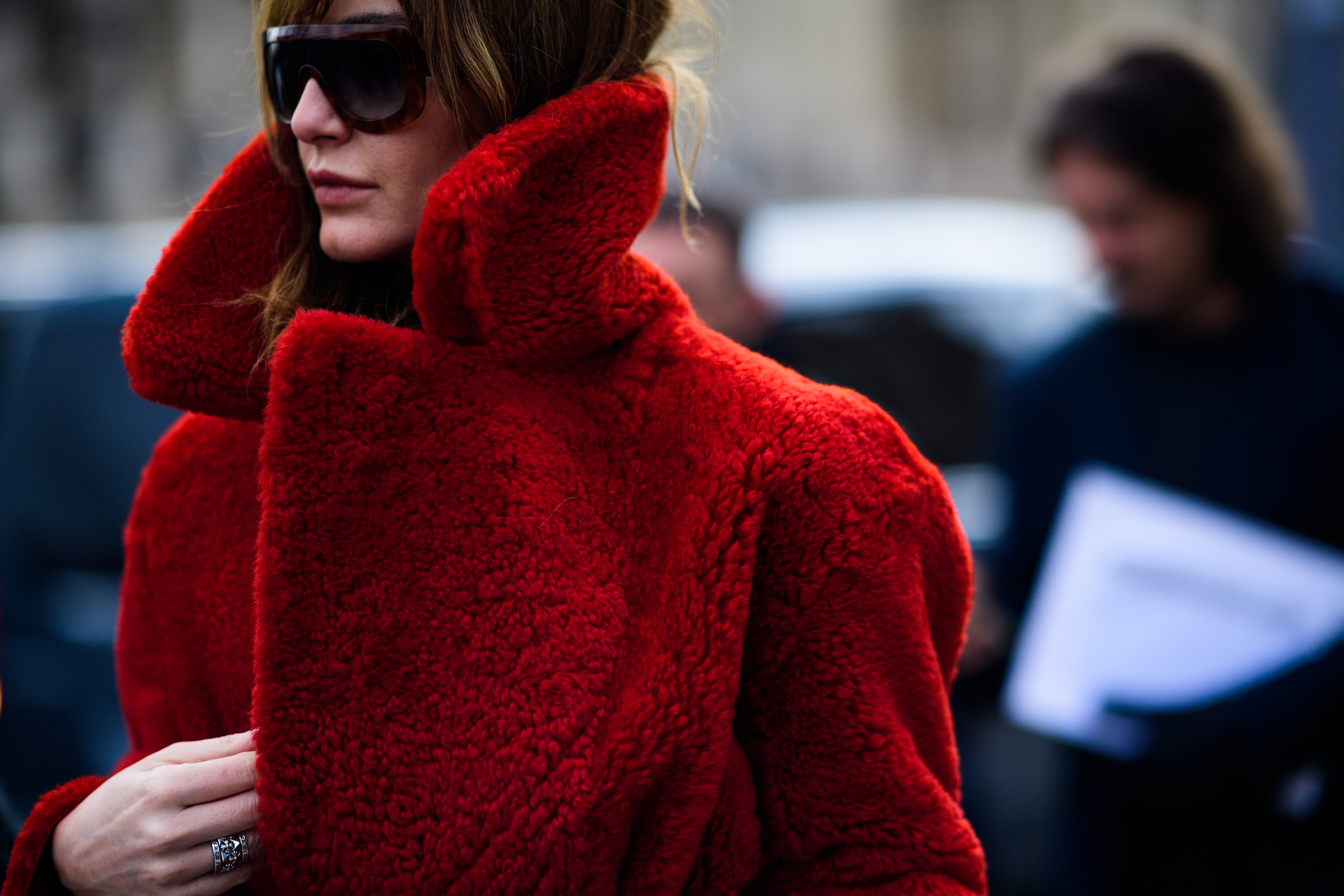 Stylist wearing red fur coat