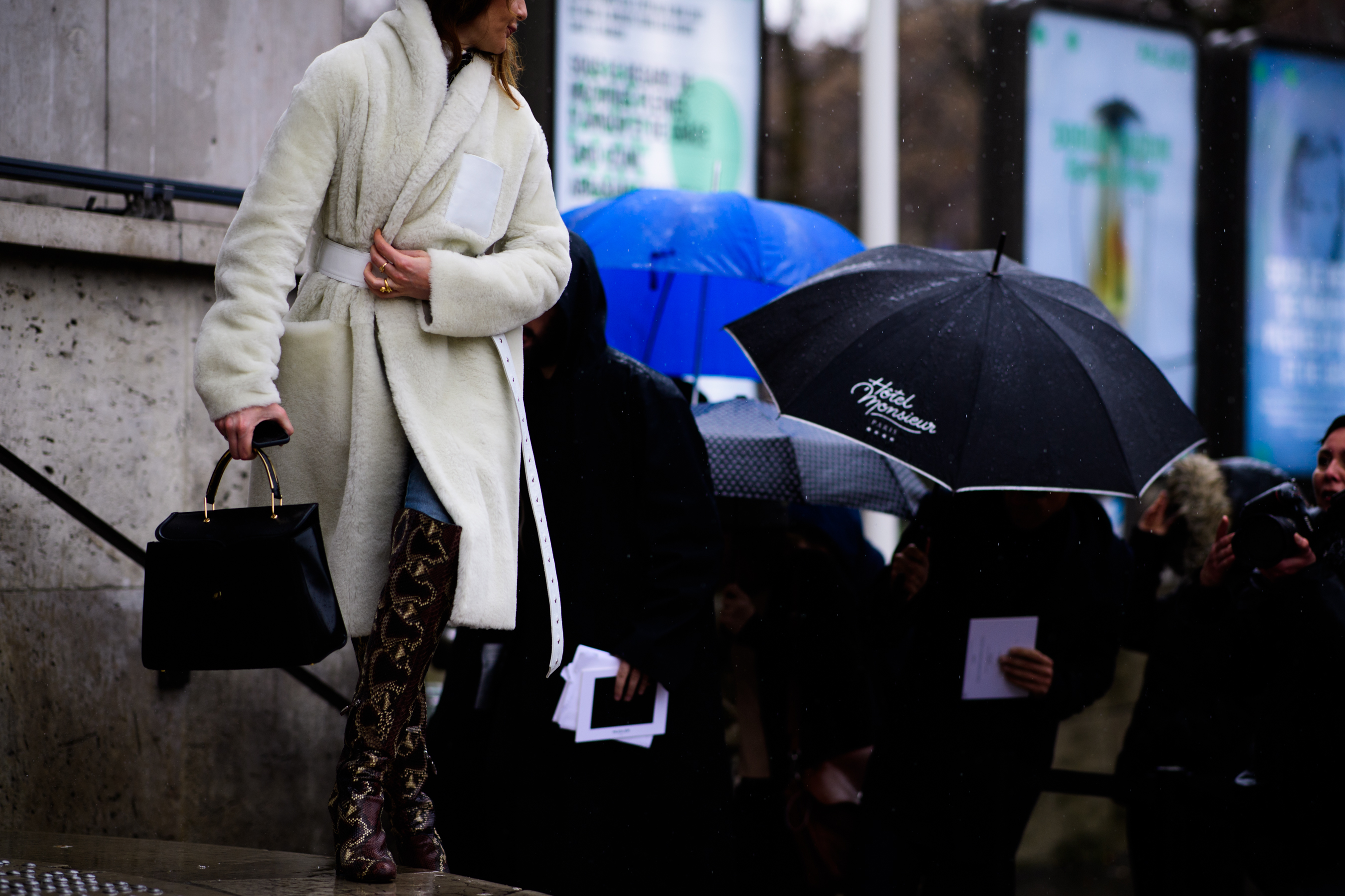 Stylist wearing white fur coat