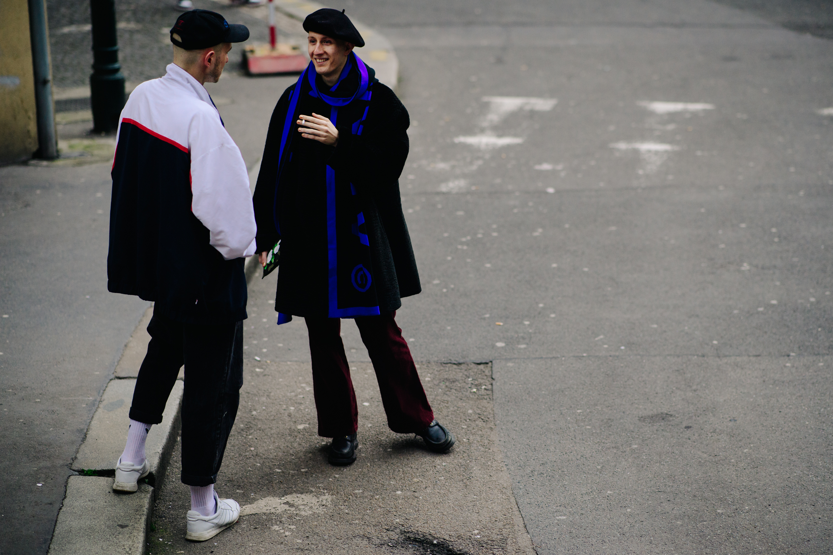 Two men wearing hats before a show