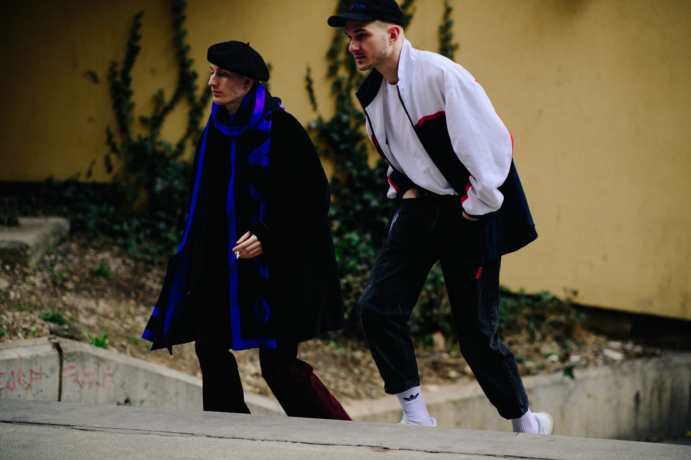Two men wearing hats before a show