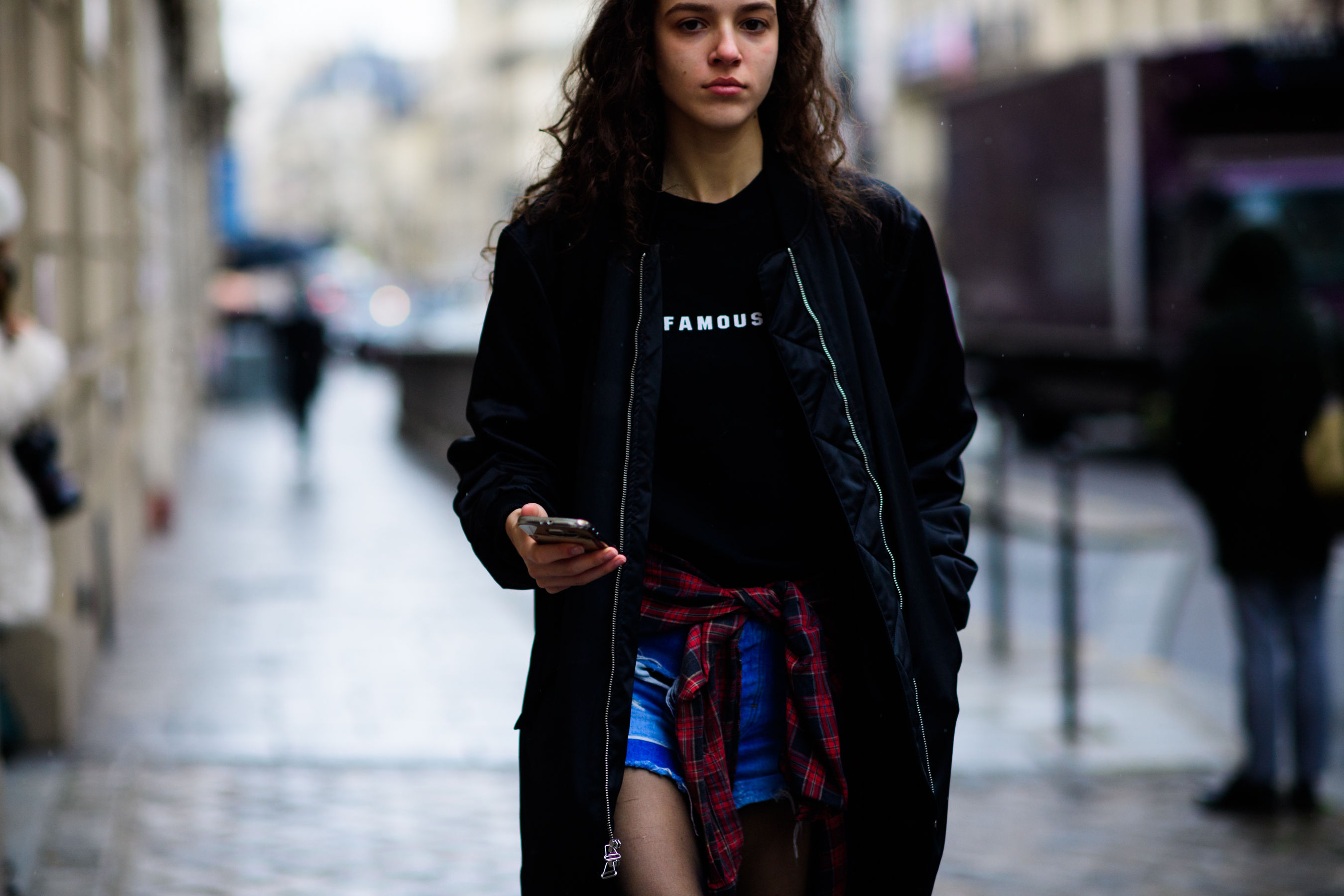 Model wearing long bomber jacket