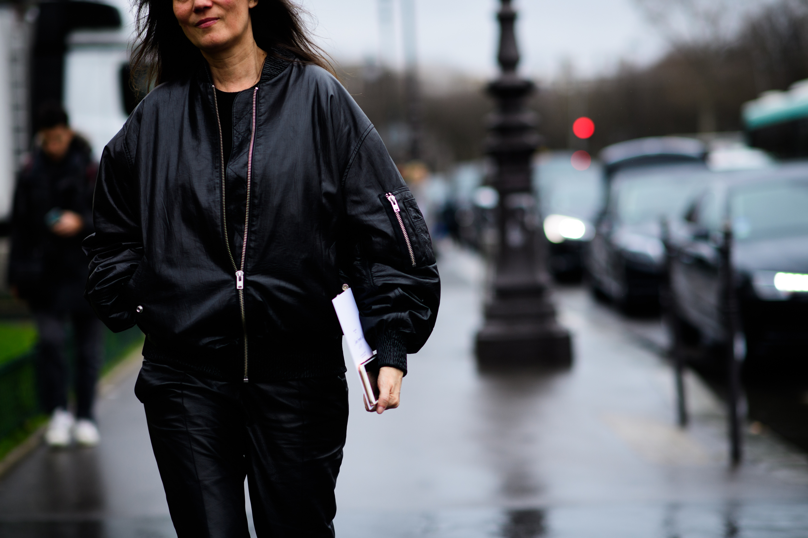 French editor wearing black bomber