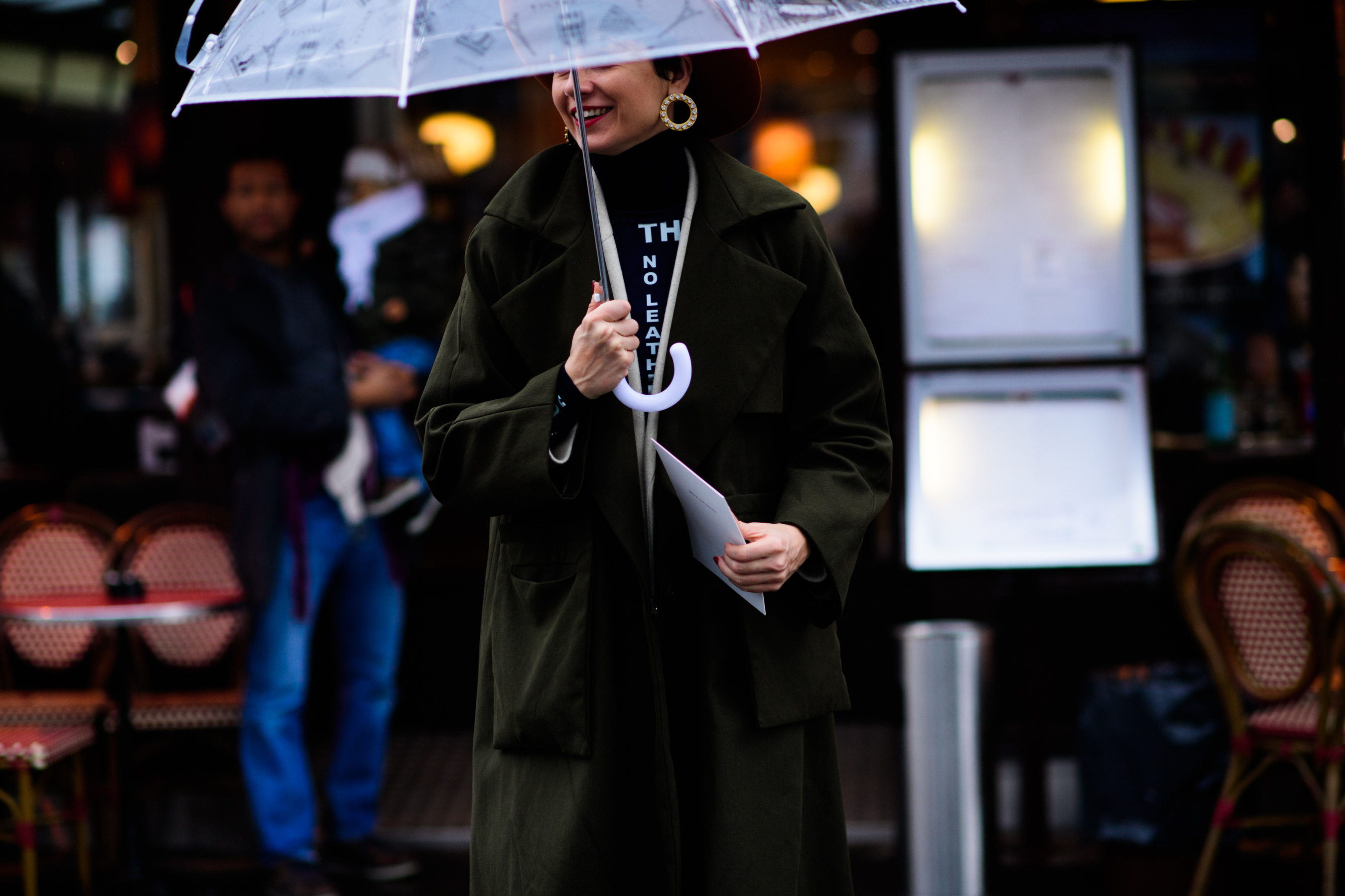 Woman wearing green trench coat