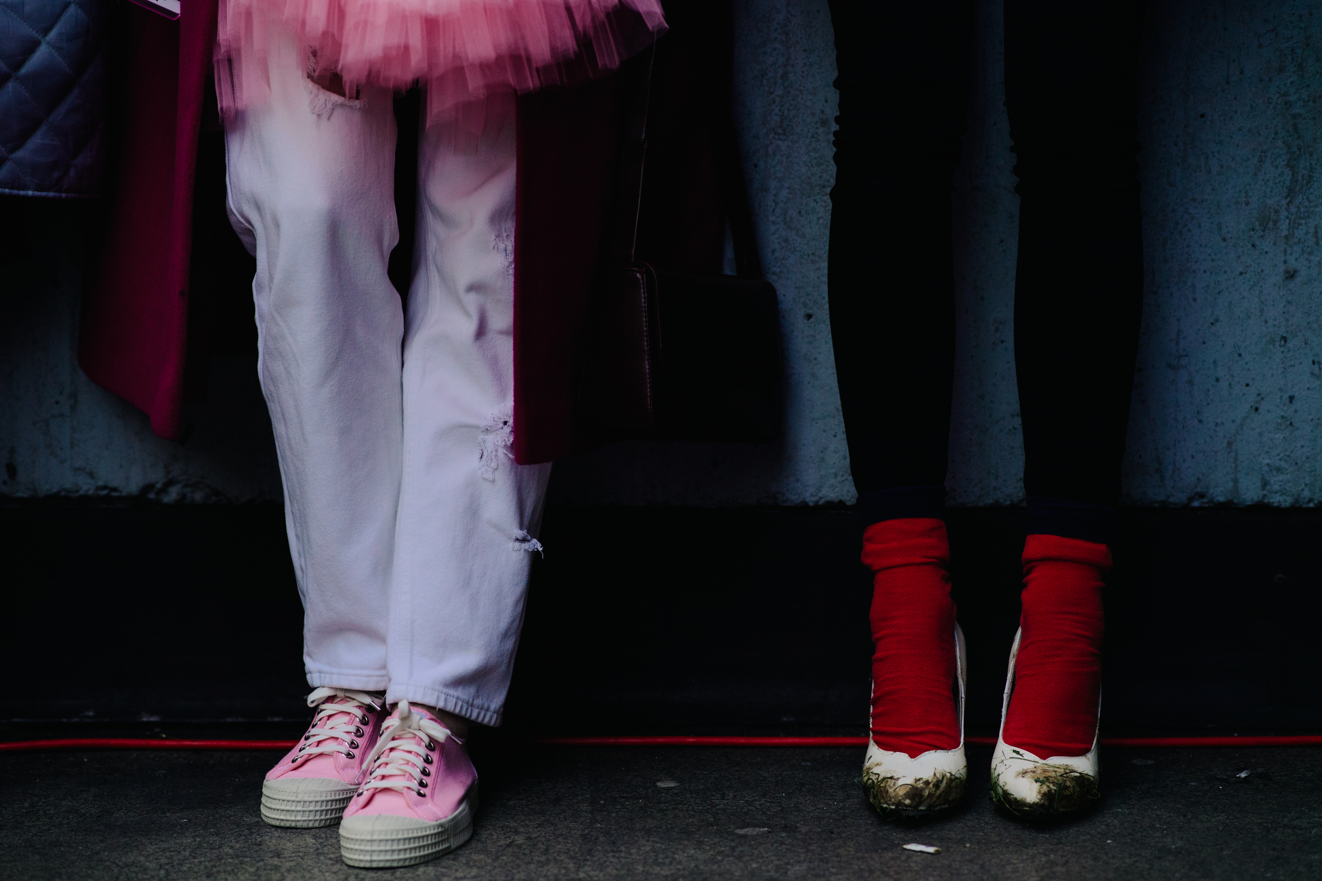 Two women wearing socks and shoes