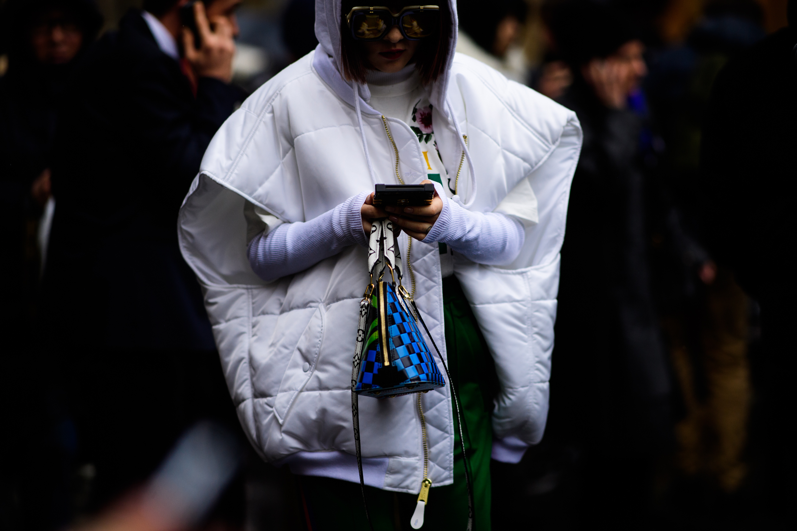 Woman wearing white oversized vest