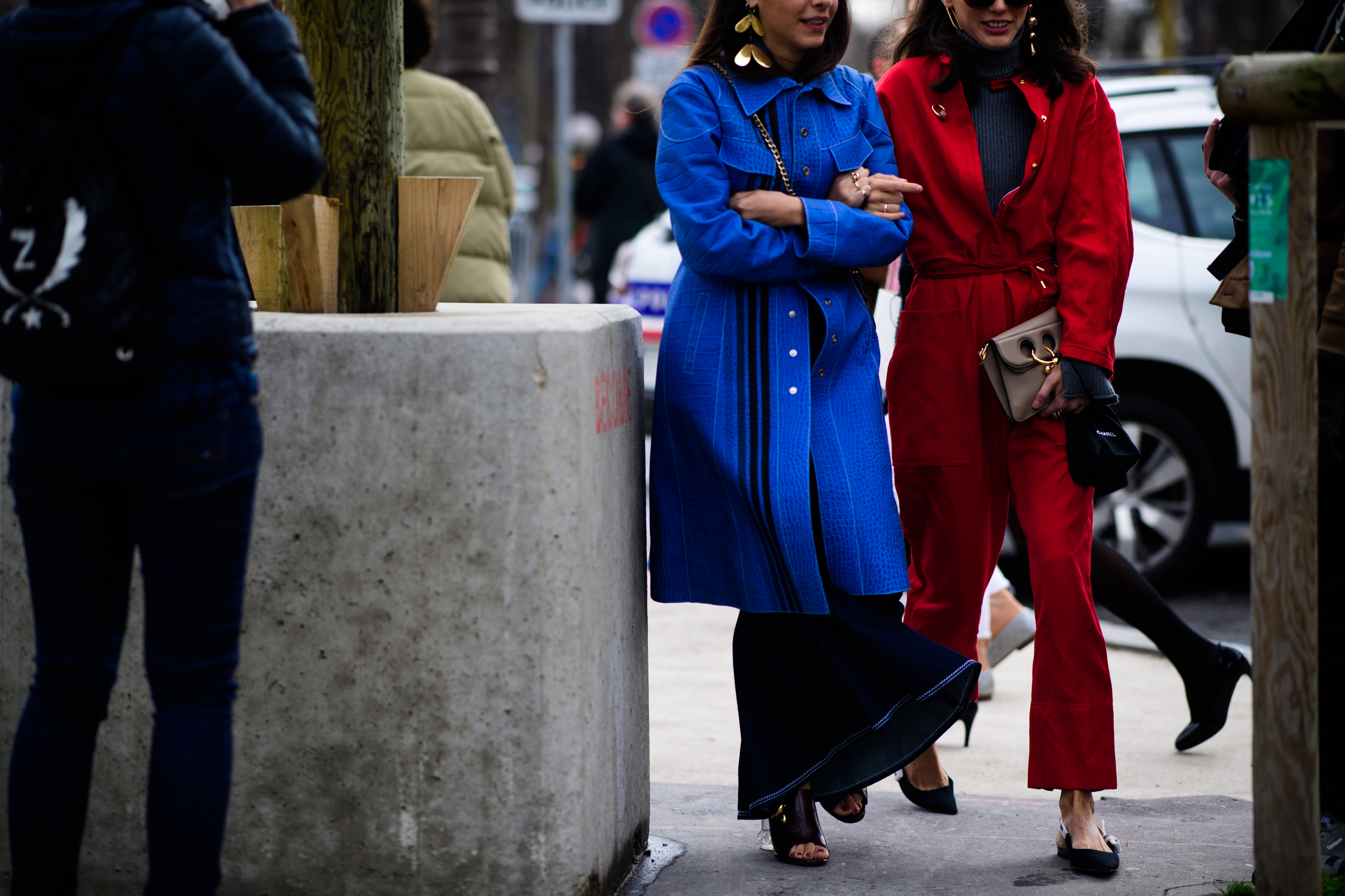 Two Italian women wearing blue and red