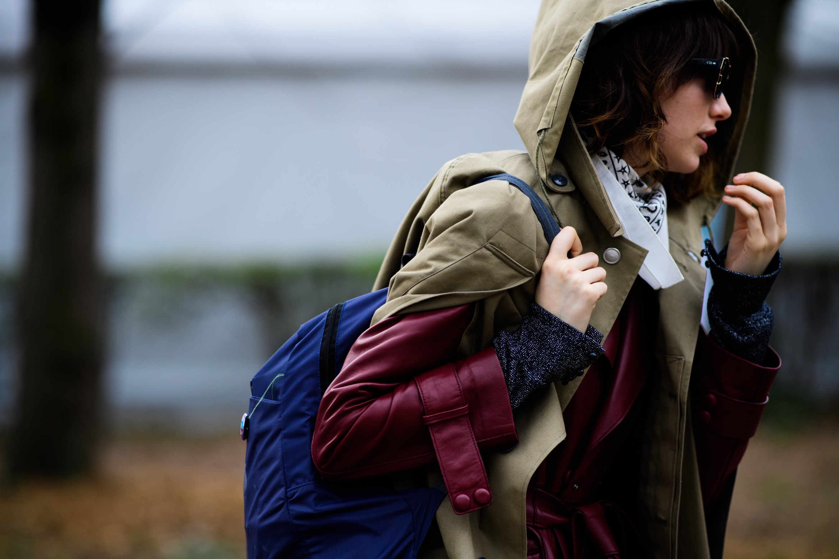 Model wearing parka over leather coat