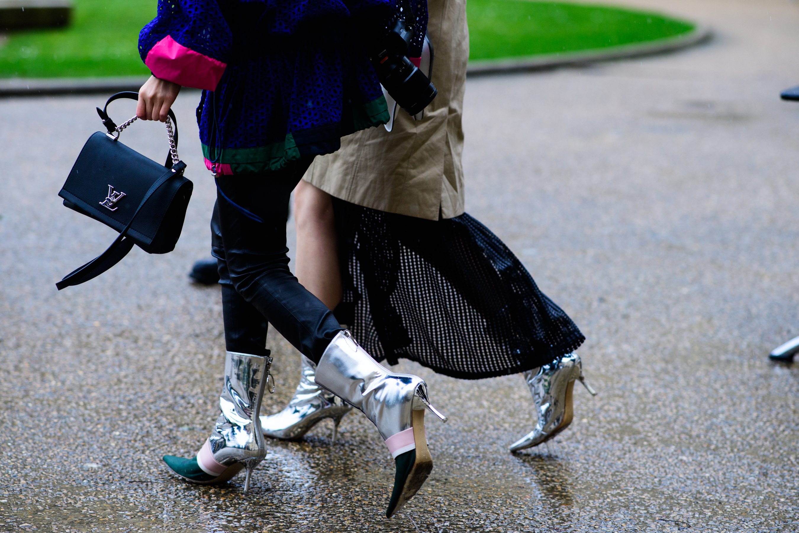 Two women wearing silver shoes