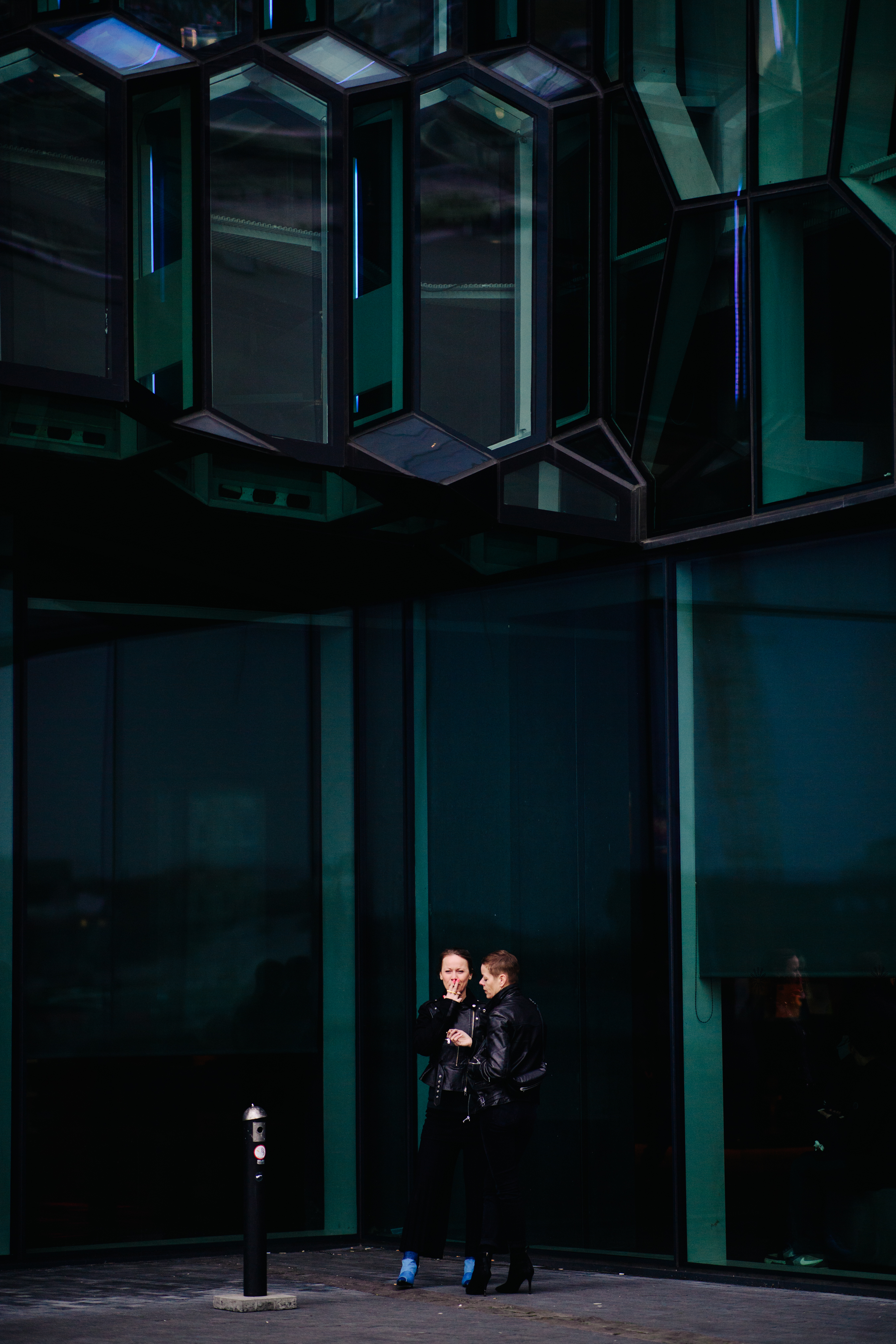 Two women wearing leather jackets