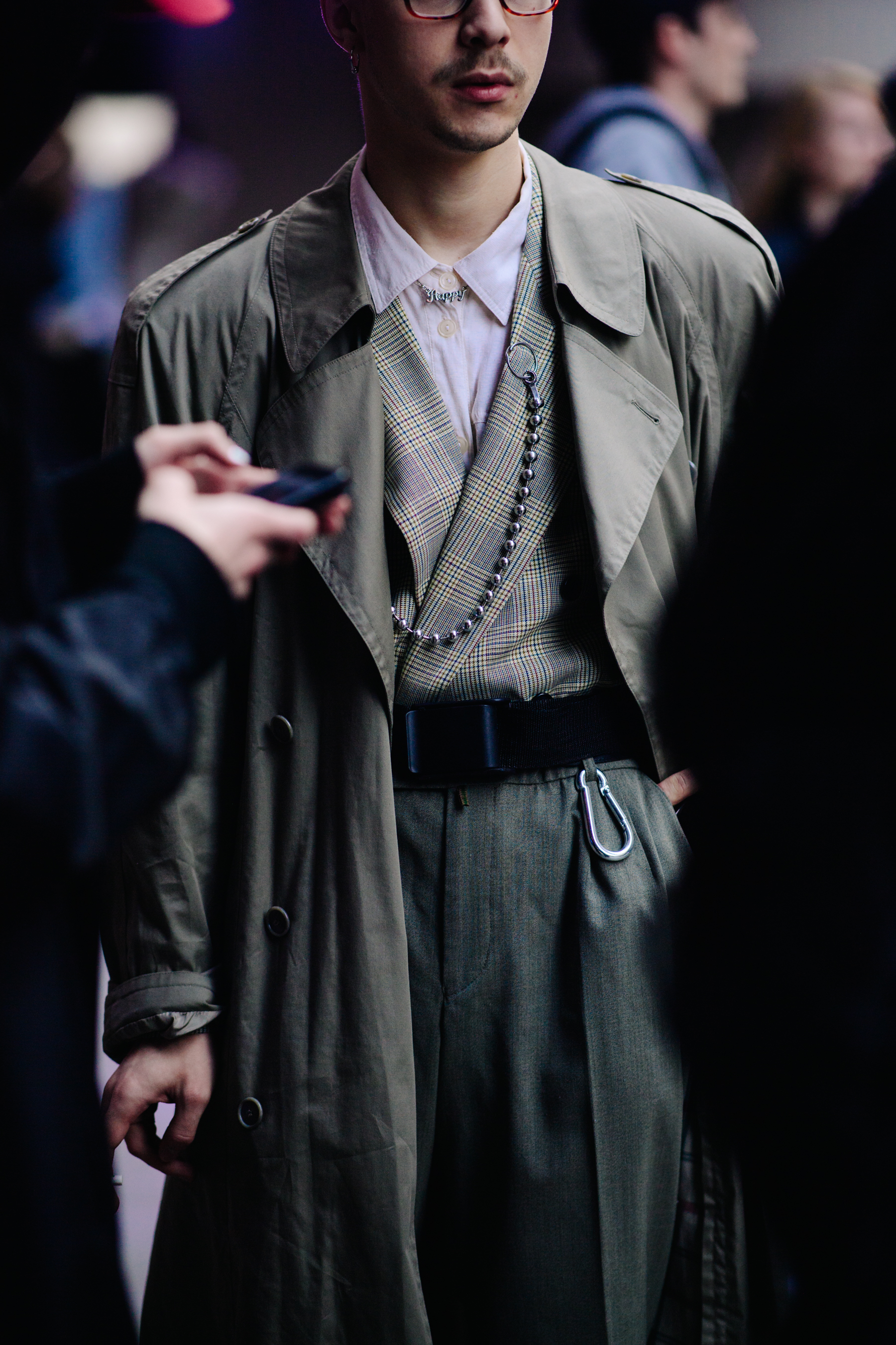 Man wearing suit and trench coat
