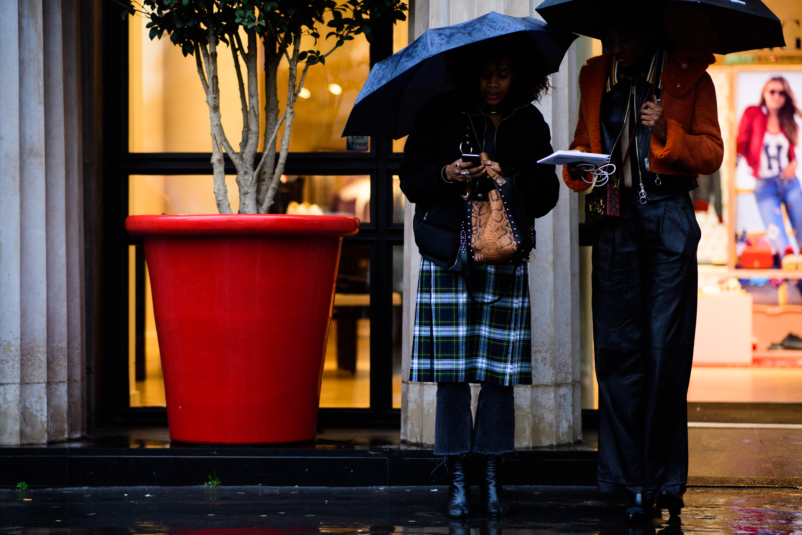 Two women with umbrellas