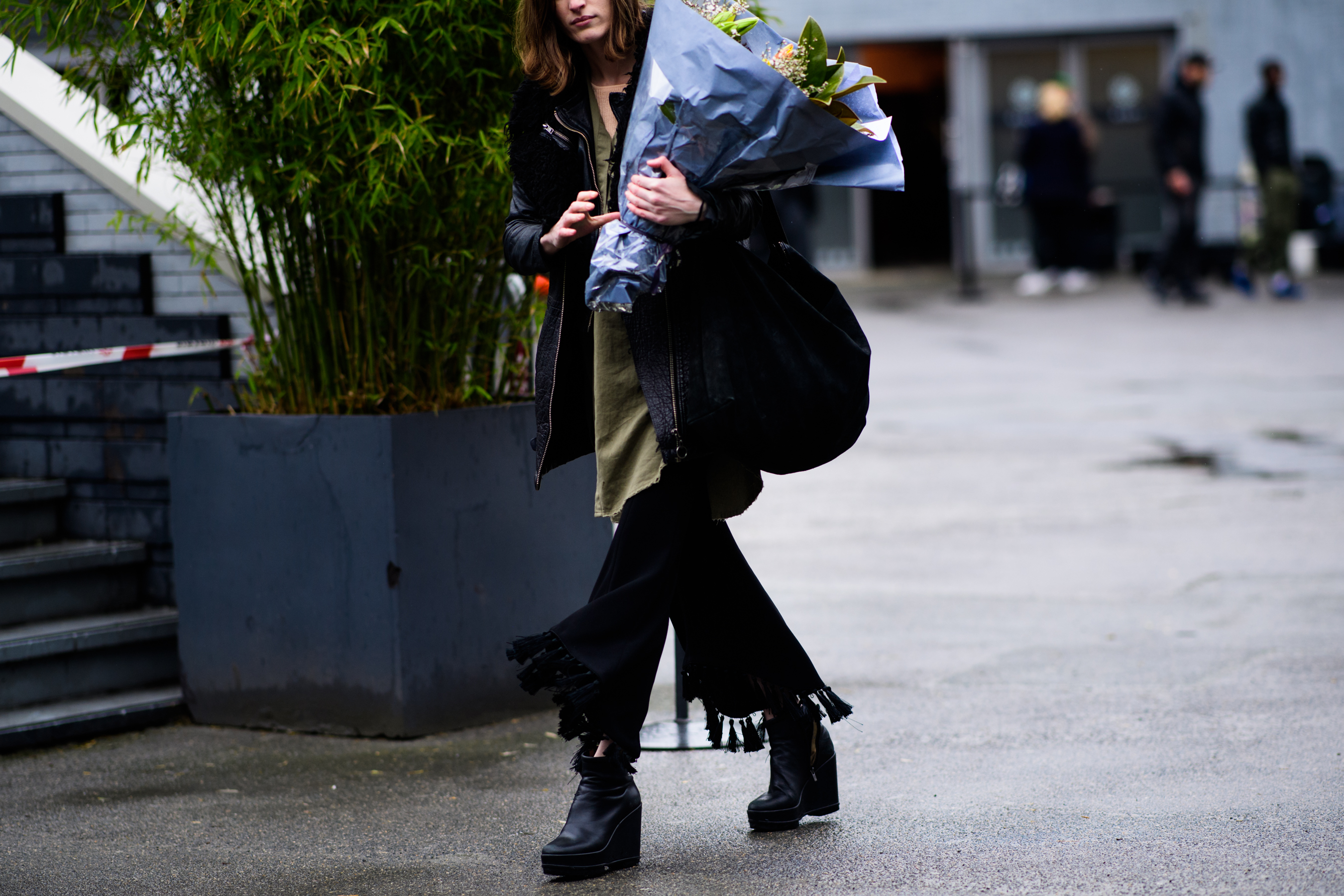 Model wearing black pants