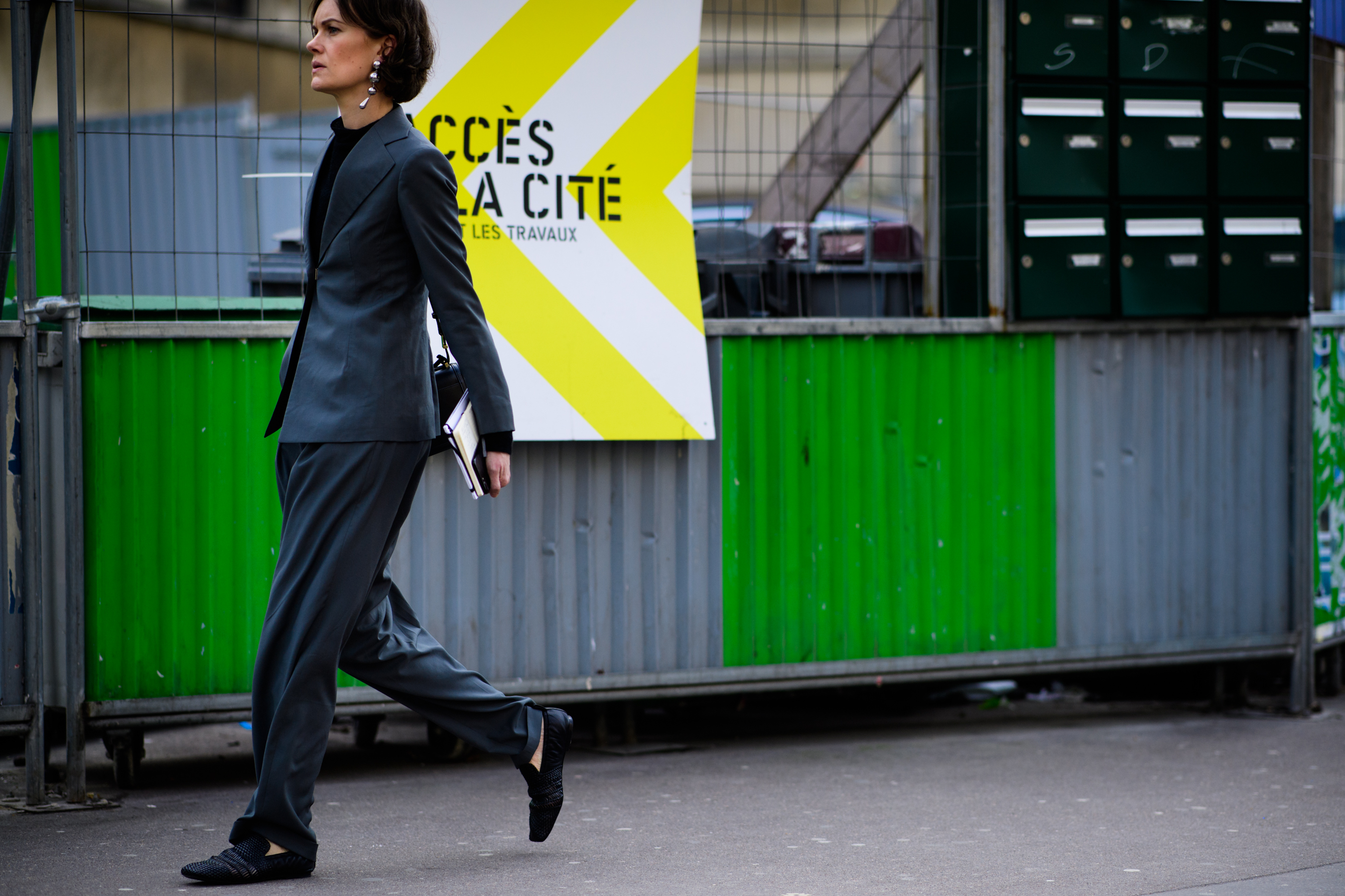 British journalist wearing grey suit