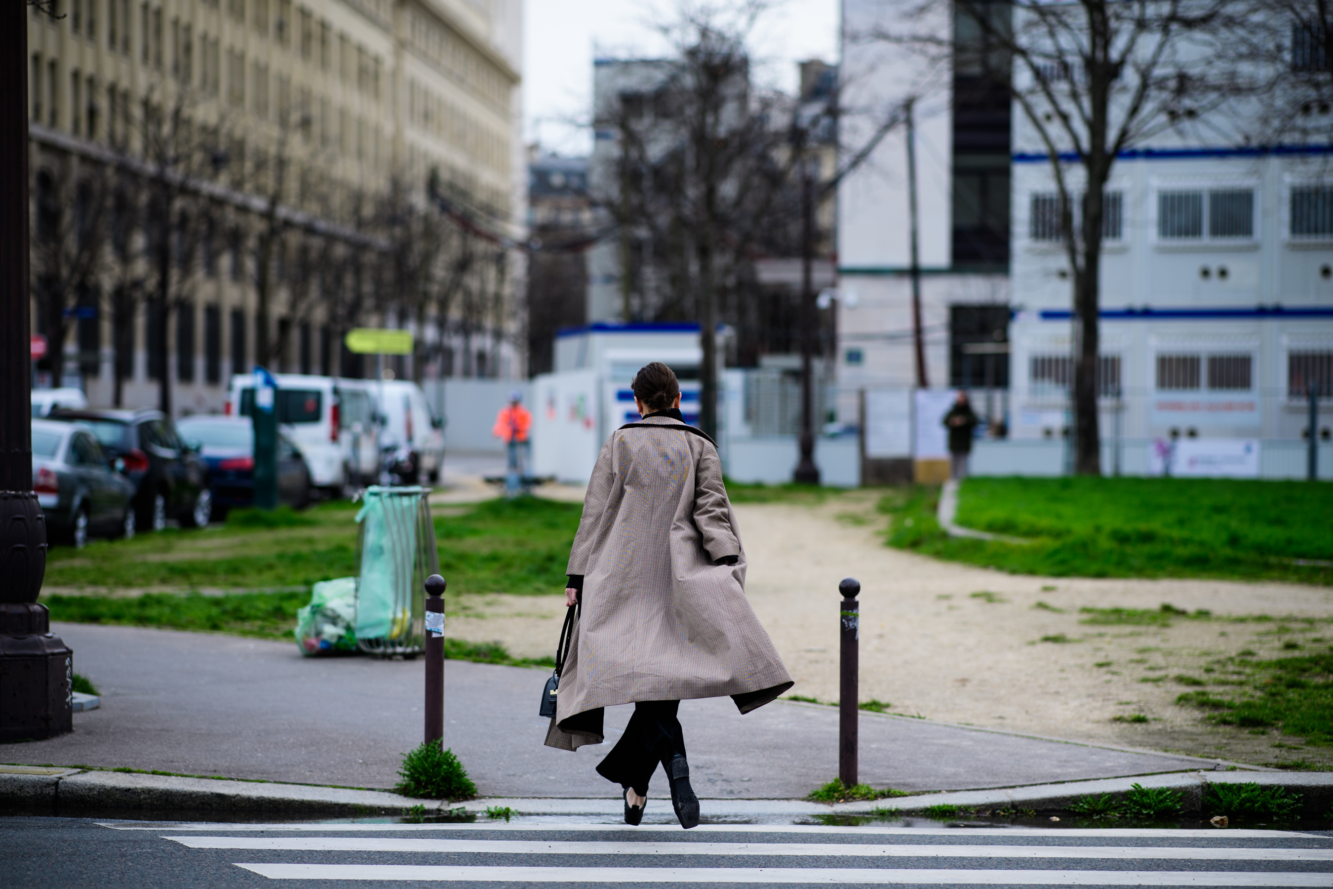 British journalist wearing long coat