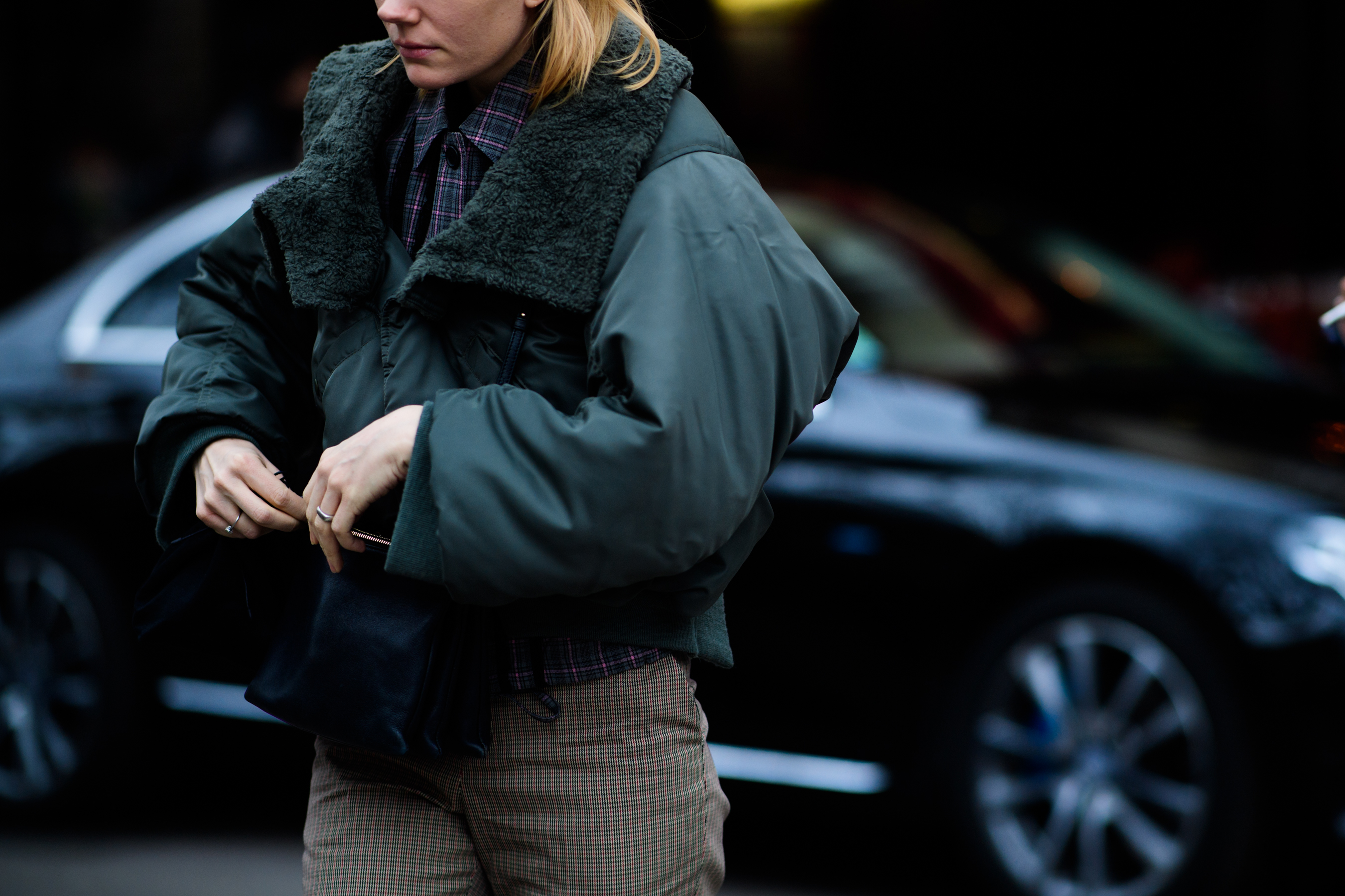 British stylist wearing green bomber