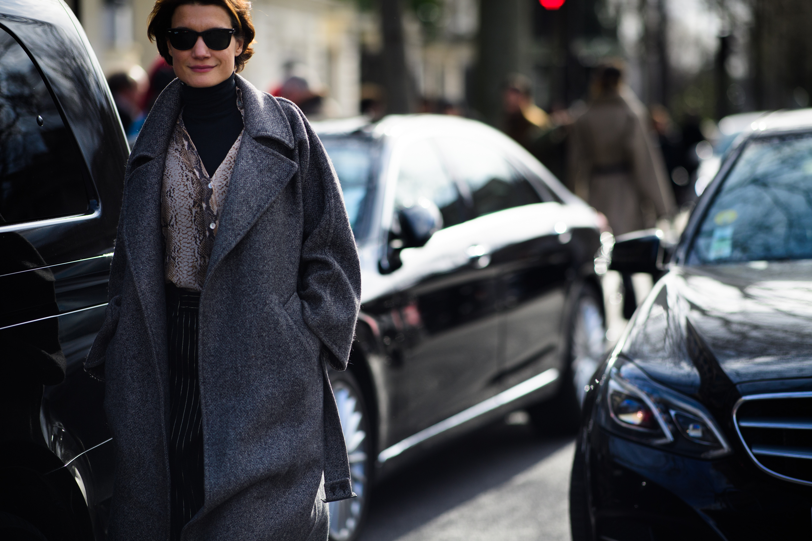 Woman wearing long gray coat