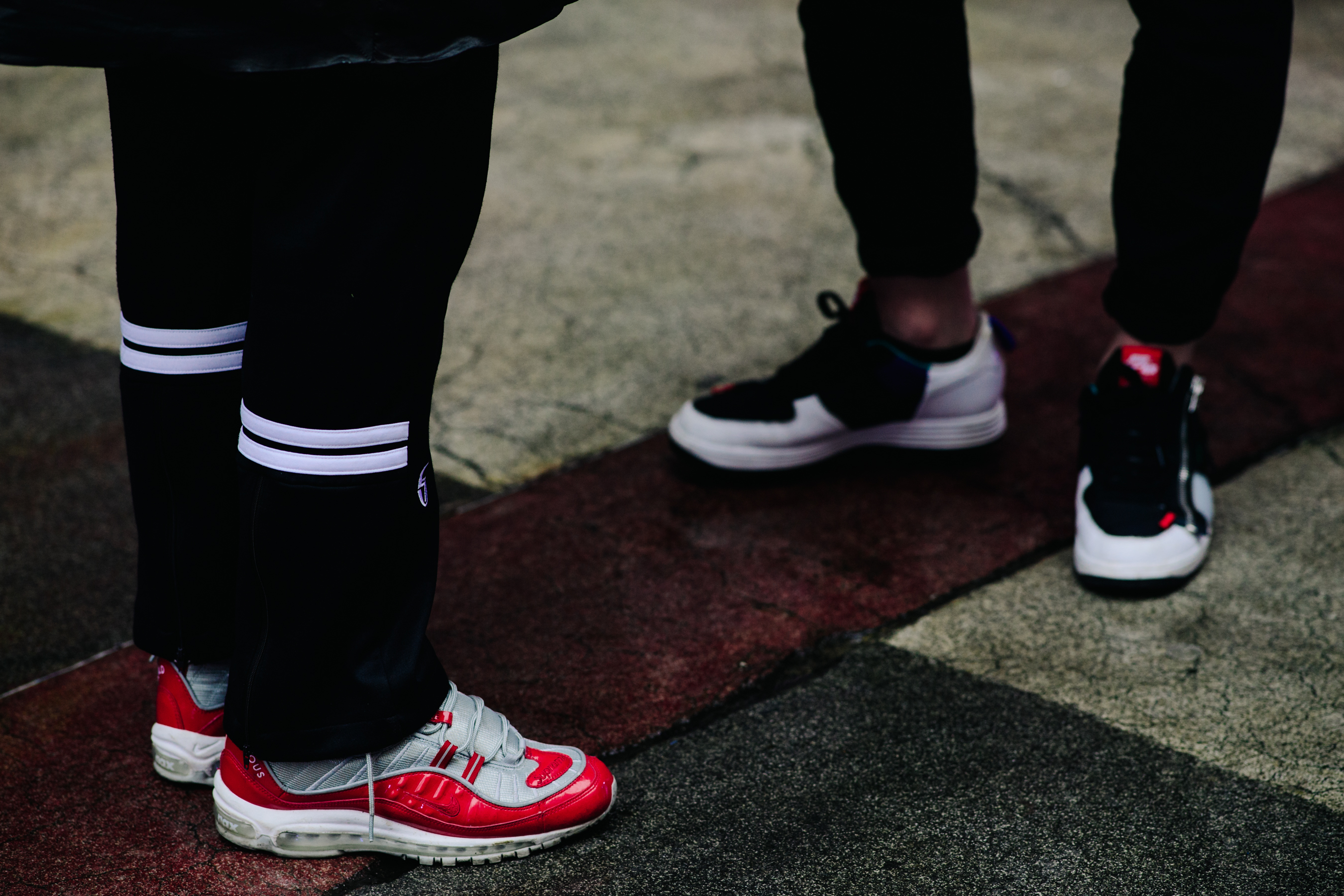 Men wearing Nike, Supreme, Acronym sneakers