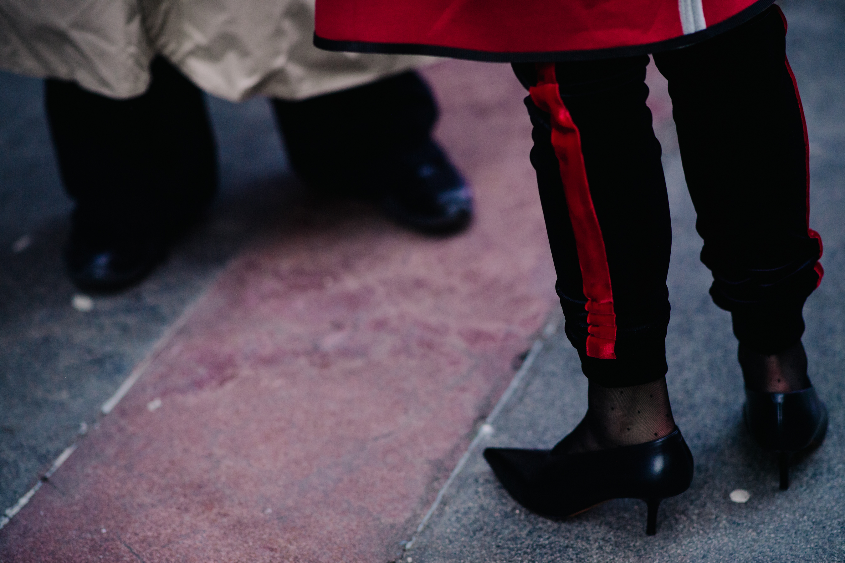 Woman wearing shoes and track pants