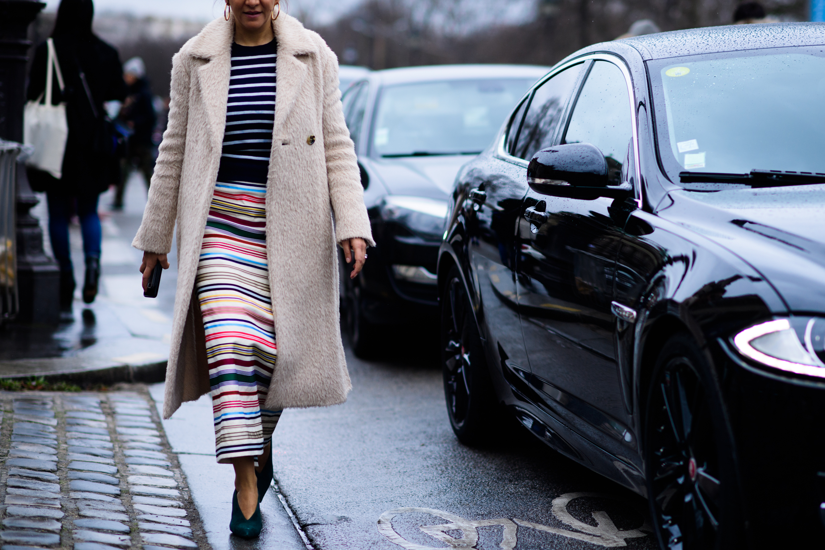 Woman wearing long white coat