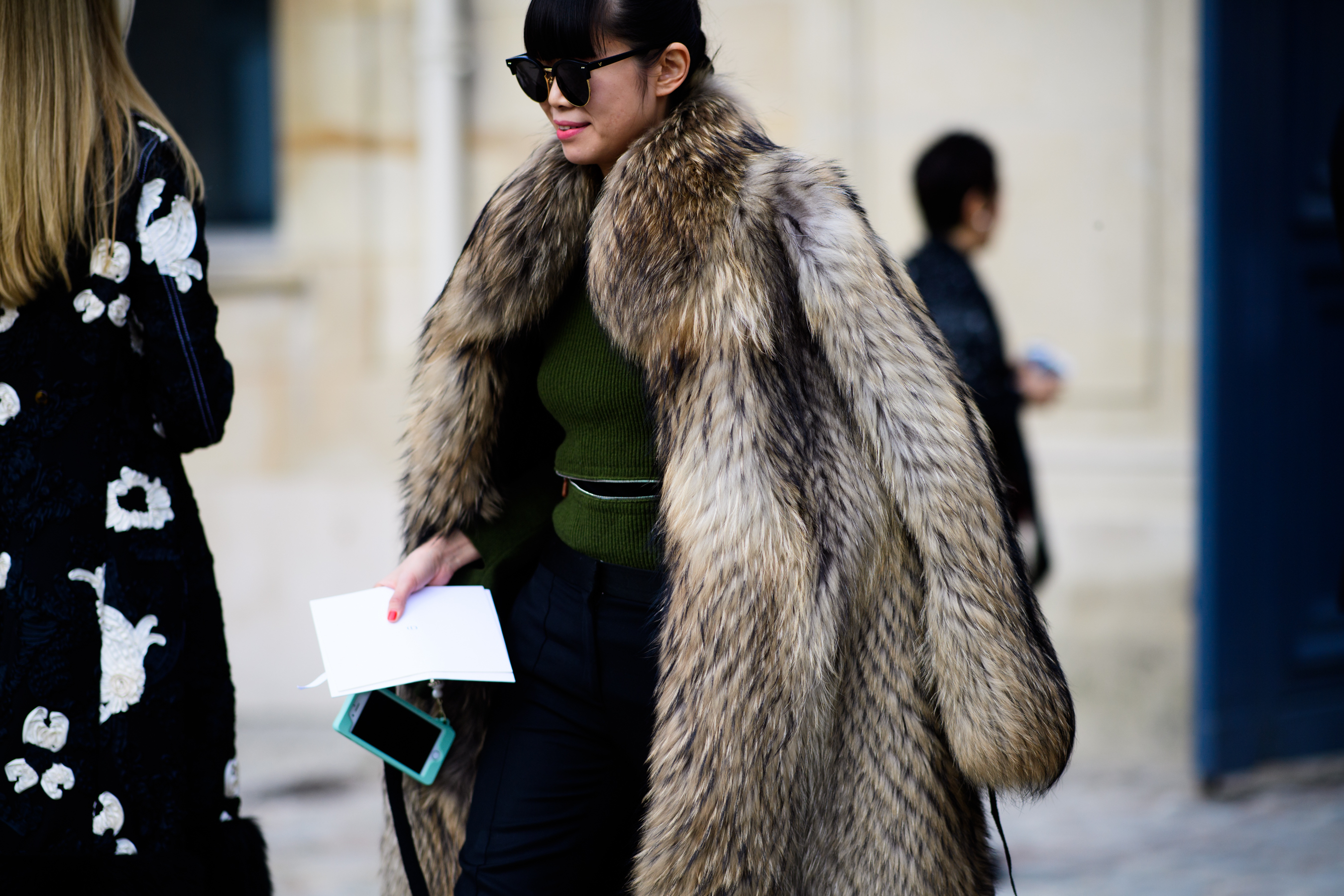 Blogger wearing big fur coat before Dior