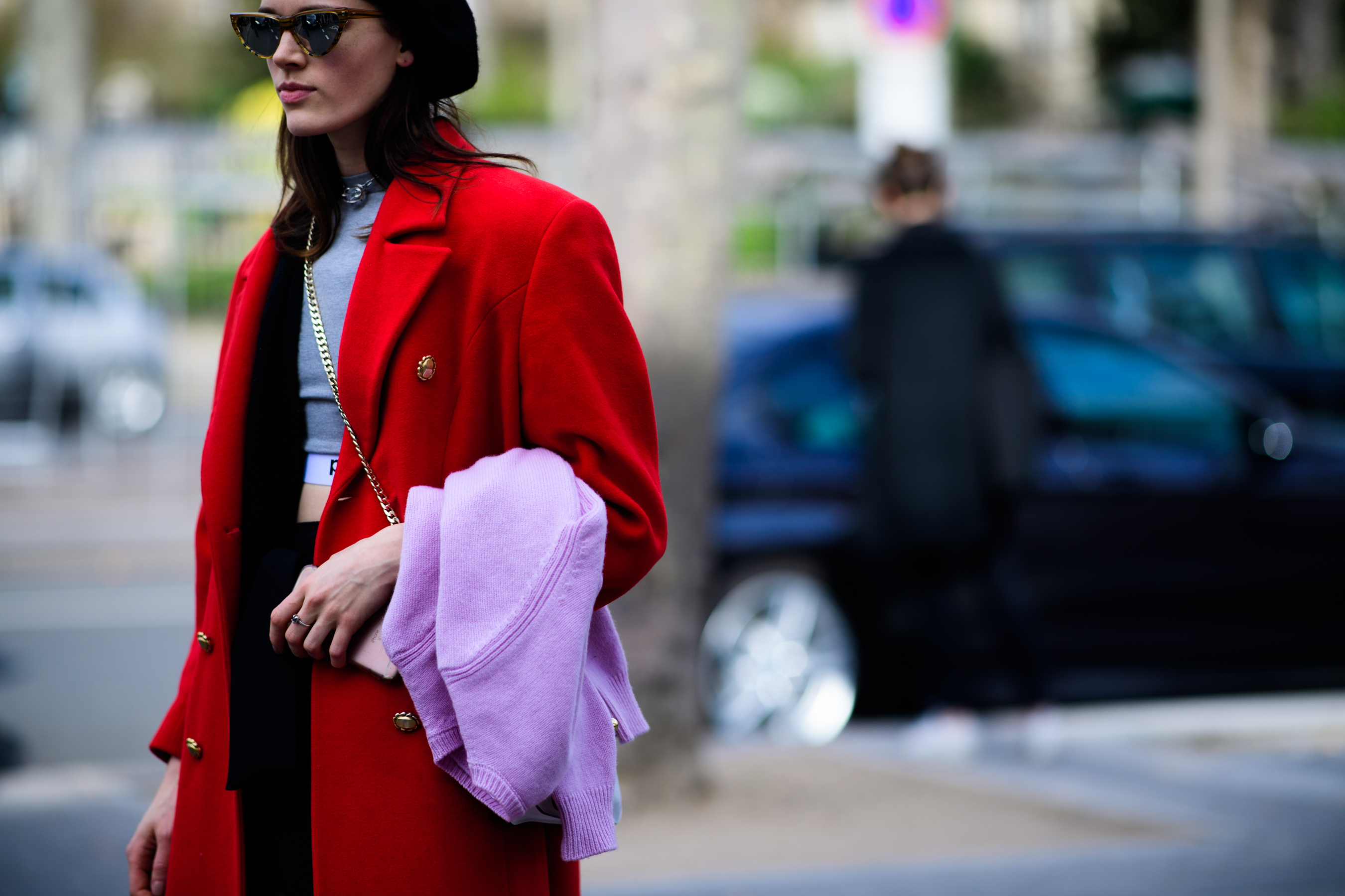 Model wearing long red coat