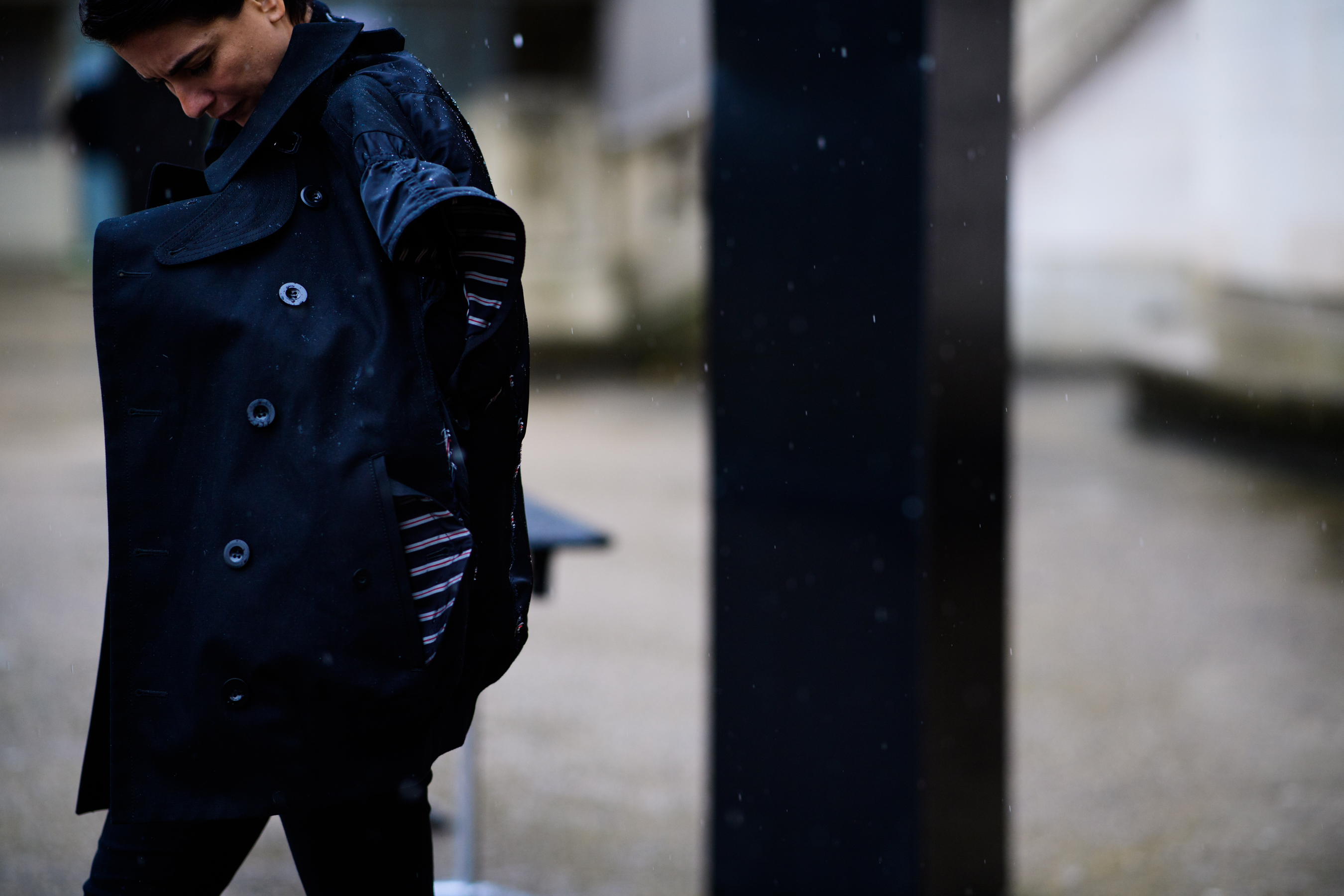 Woman wearing black oversized coat