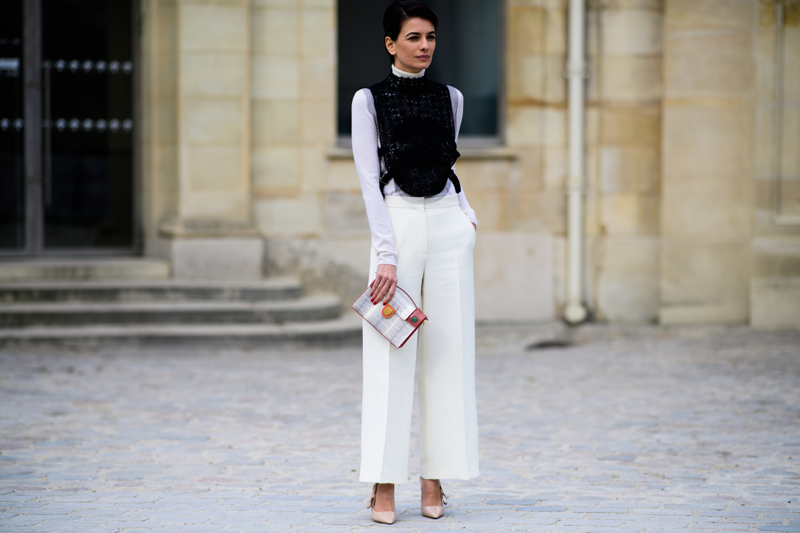 Buyer wearing white pants before Dior