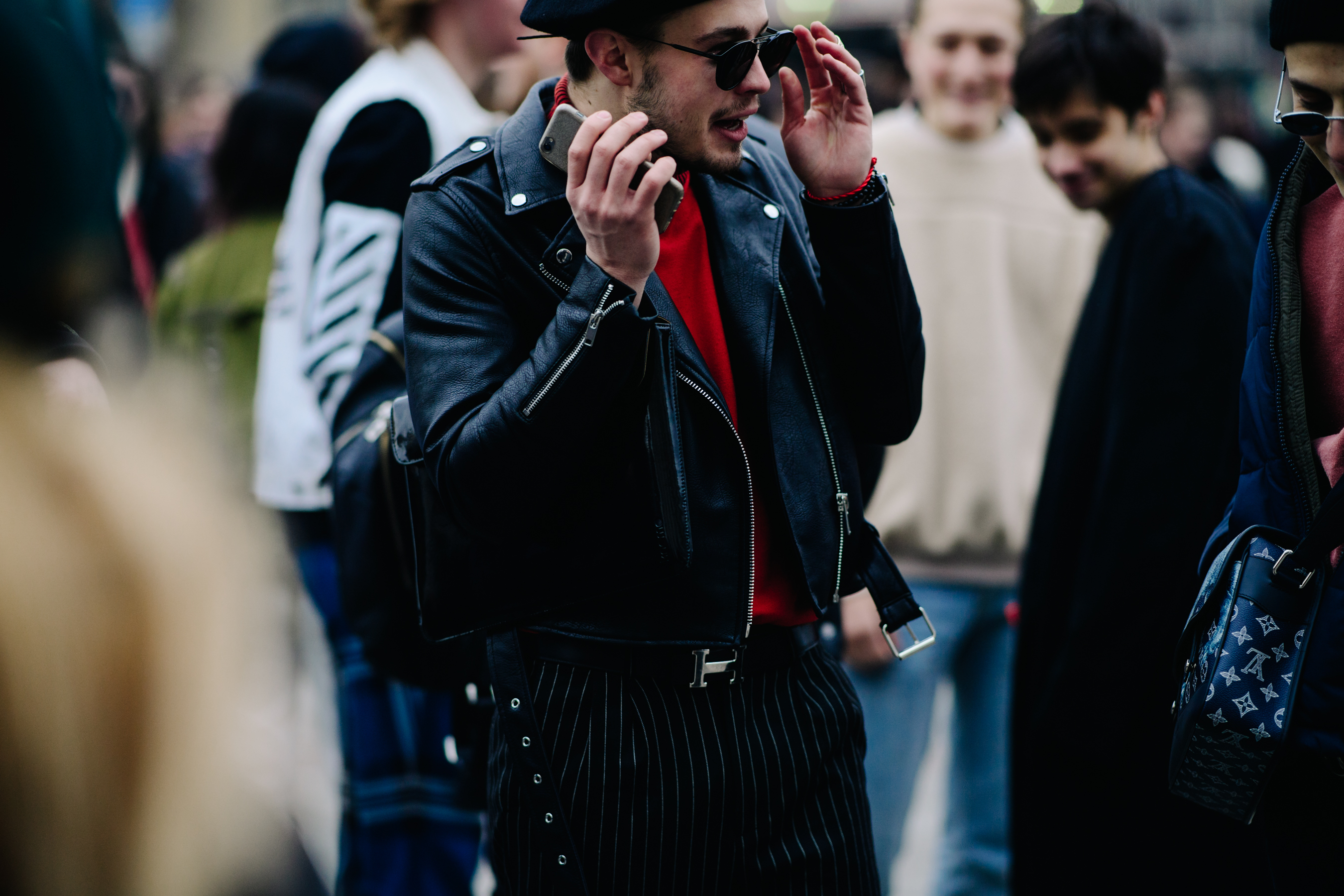 Man wearing beret and leather jacket