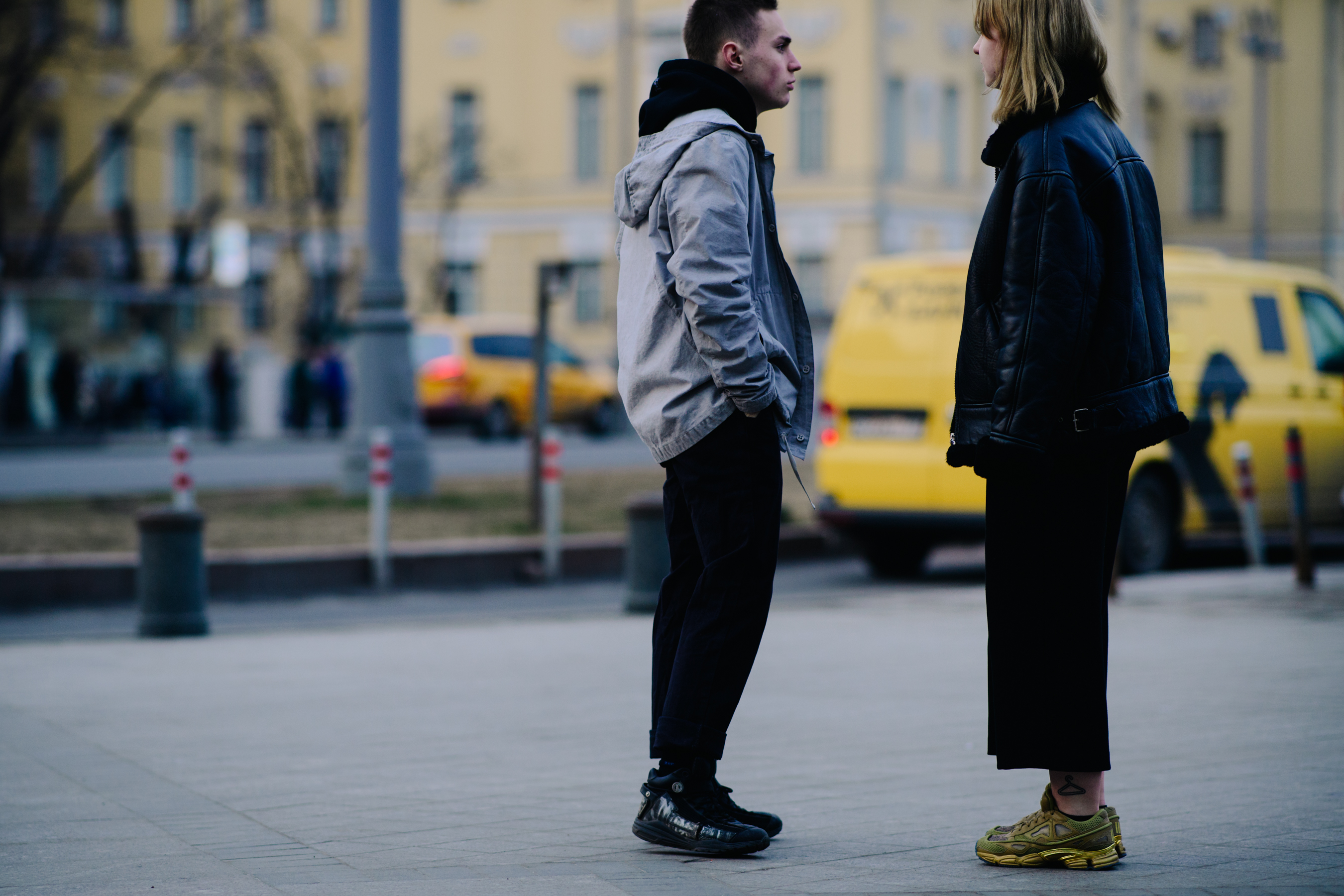 Boy and girl wearing Adidas x Raf Simons