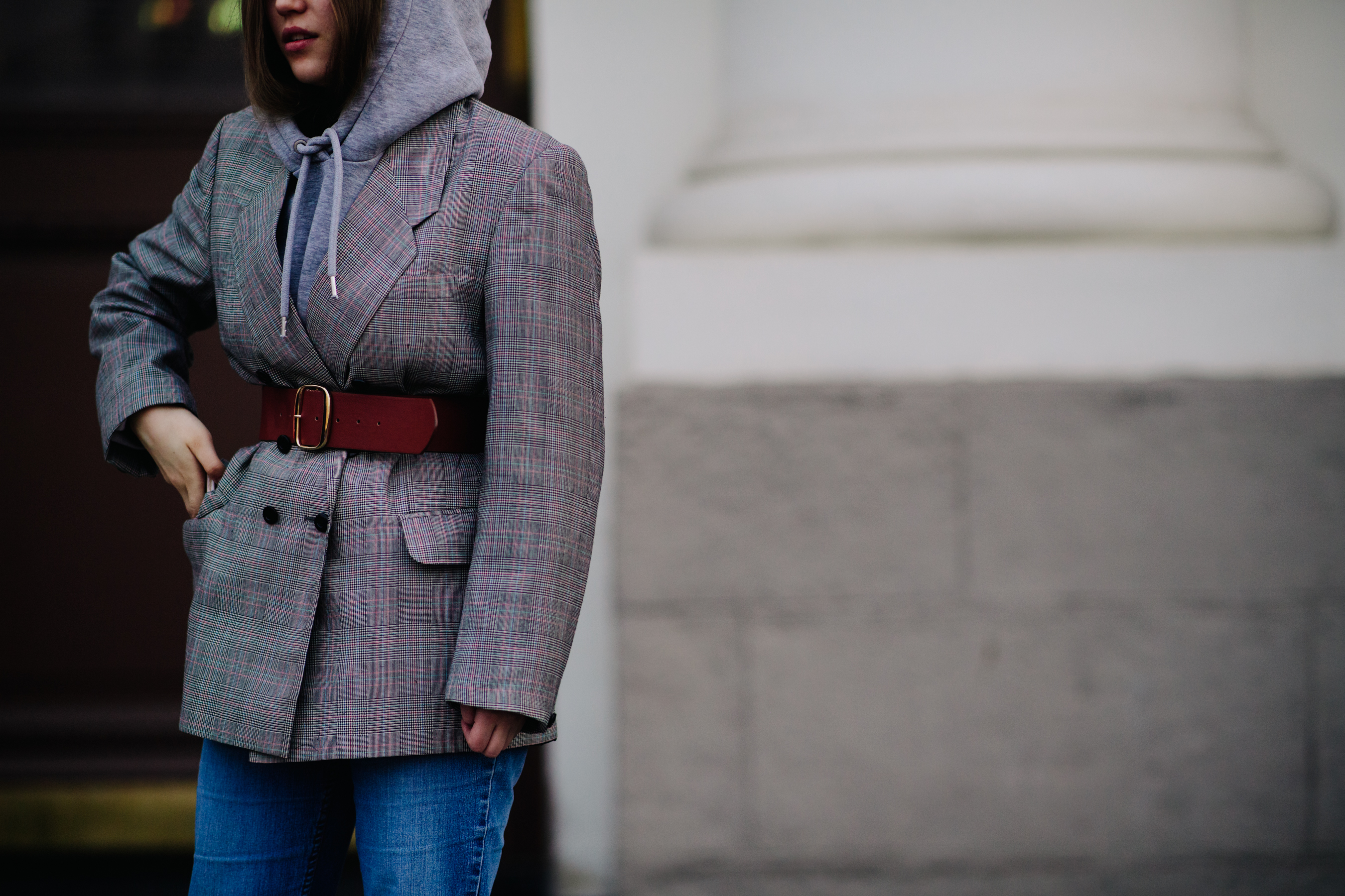 Woman wearing belted blazer